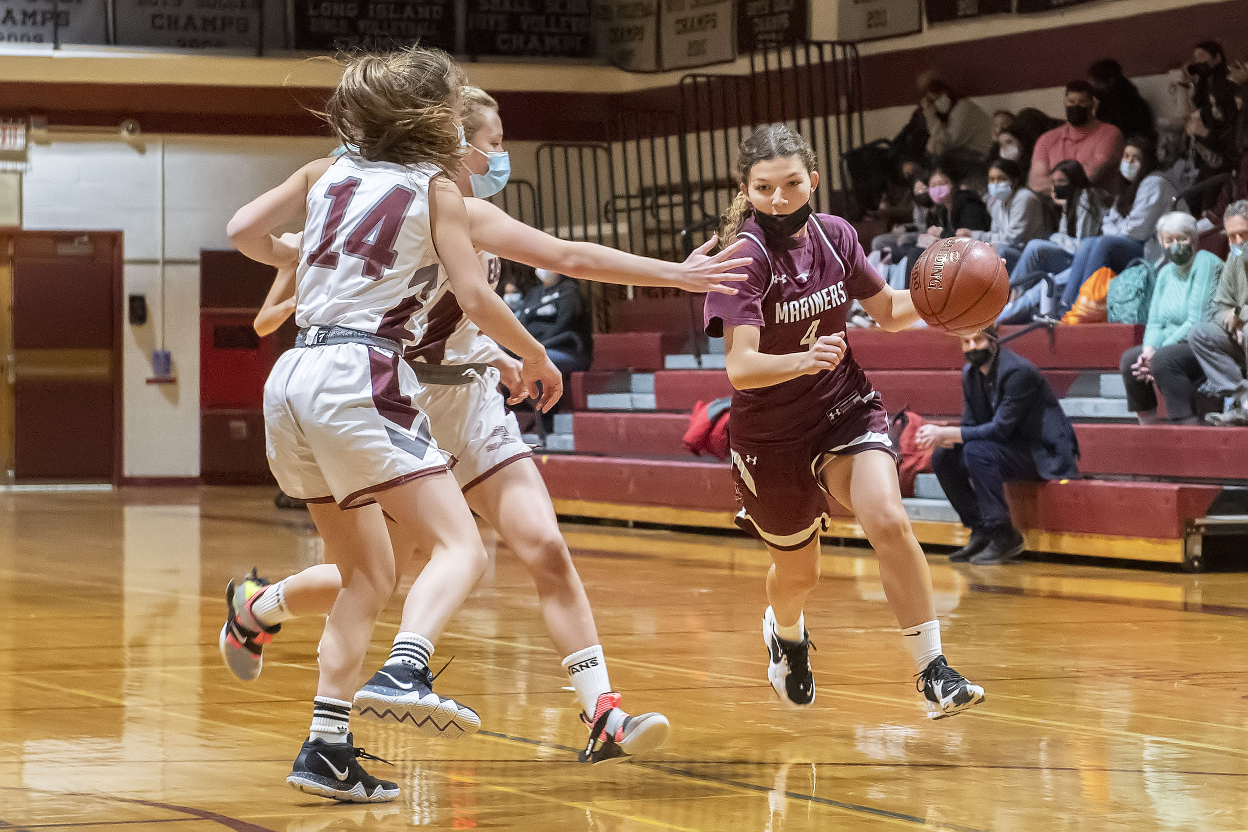 Southampton's Gabriella Arnold makes her way past East Hampton defenders.