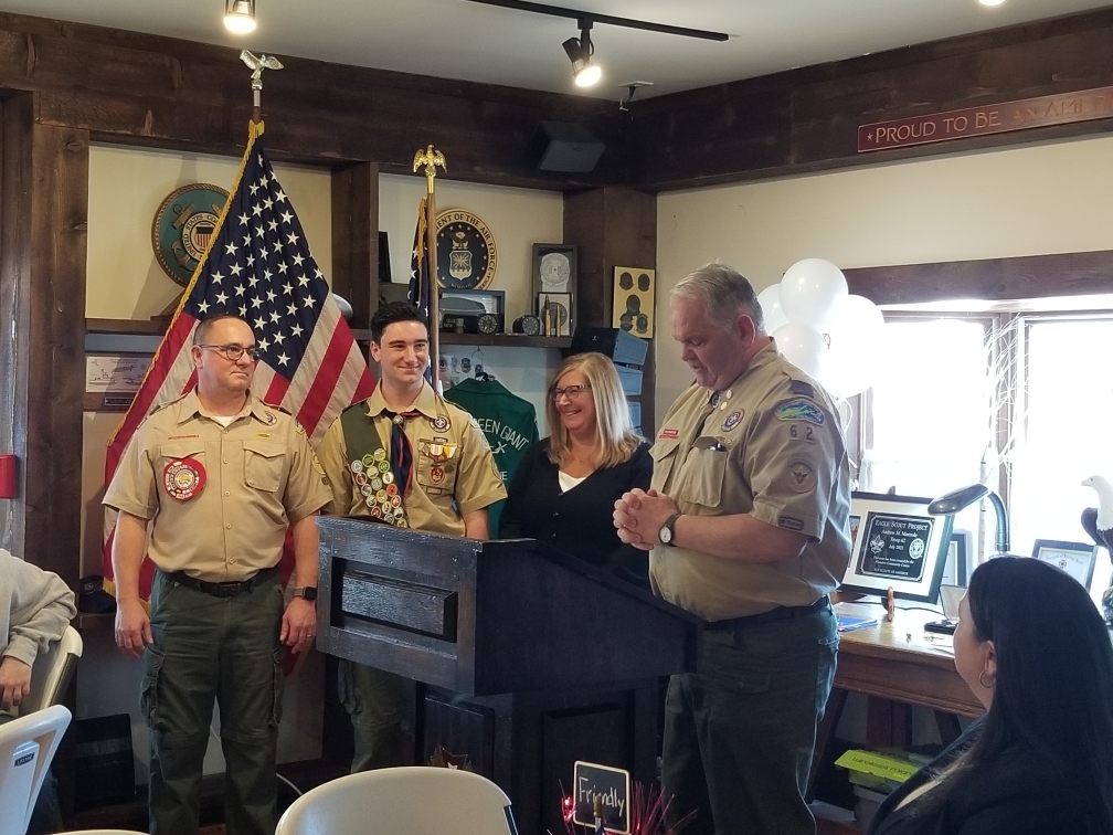 A Court of Honor was held at VFW Post 5350 in Westhampton Beach on February 12, honoring Andrew Mastrole, who has earned the rank of Eagle Scout.  Andrew is a member of Troop 62 and is the 21st scout from the troop to attain Eagle status.  The event was attended by numerous public officials, family, friends and Scouts from Troop 62 and Troop 483.  From left,  Mike Mastrole (father) Andrew, Diane Mastrole (mother) and Billy Dalton, past Scoutmaster.