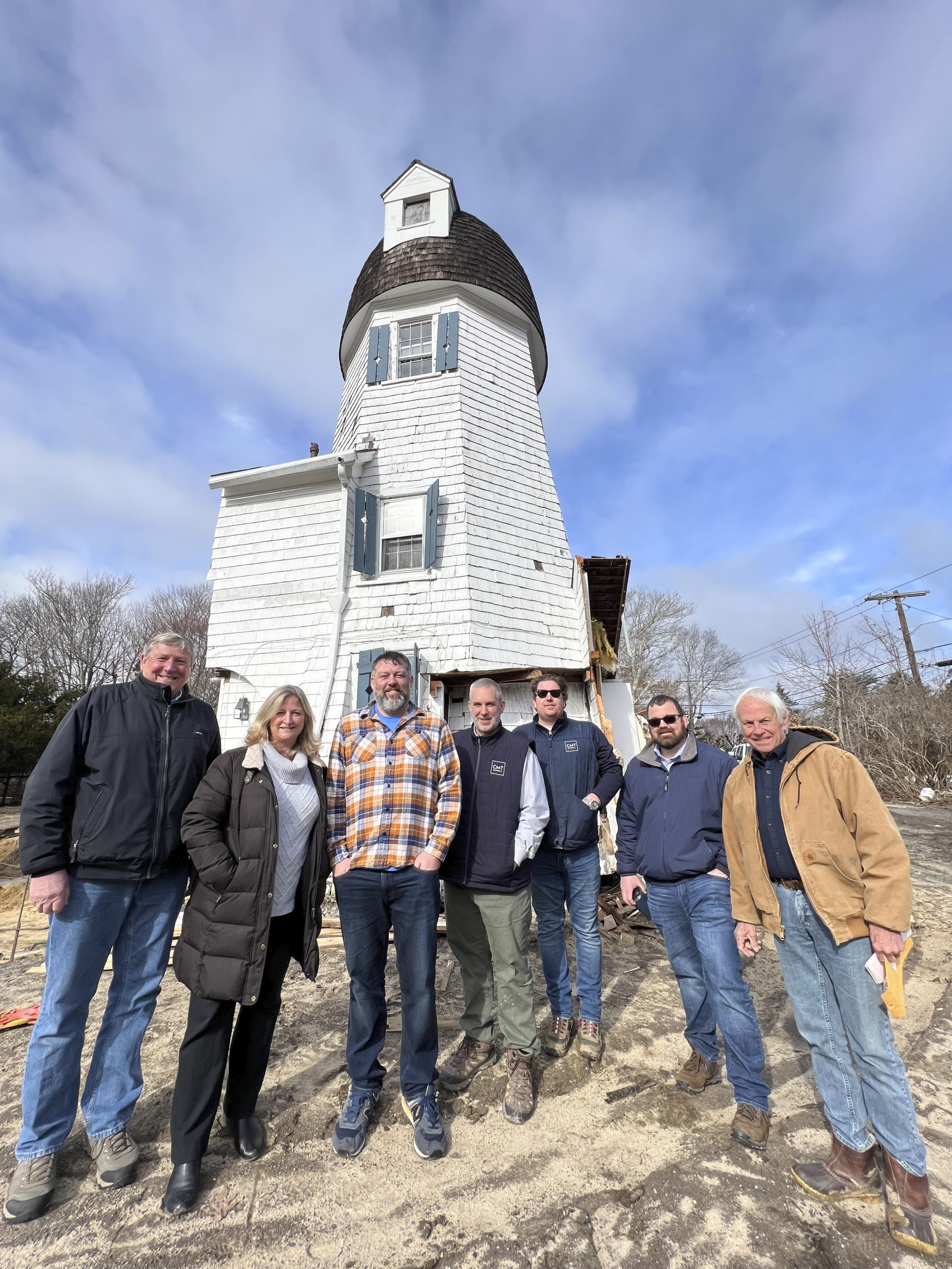 Westhampton Beach Village Deputy Mayor Ralph Urban, Mayor Maria Moore, trustee Brian Tymann, CMT Builders Inc. owners Chris Truhn and Justin Schnepf, consultant Nick Bono and Larry Jones at the Dix Windmill in Westhampton Beach.   DANA SHAW