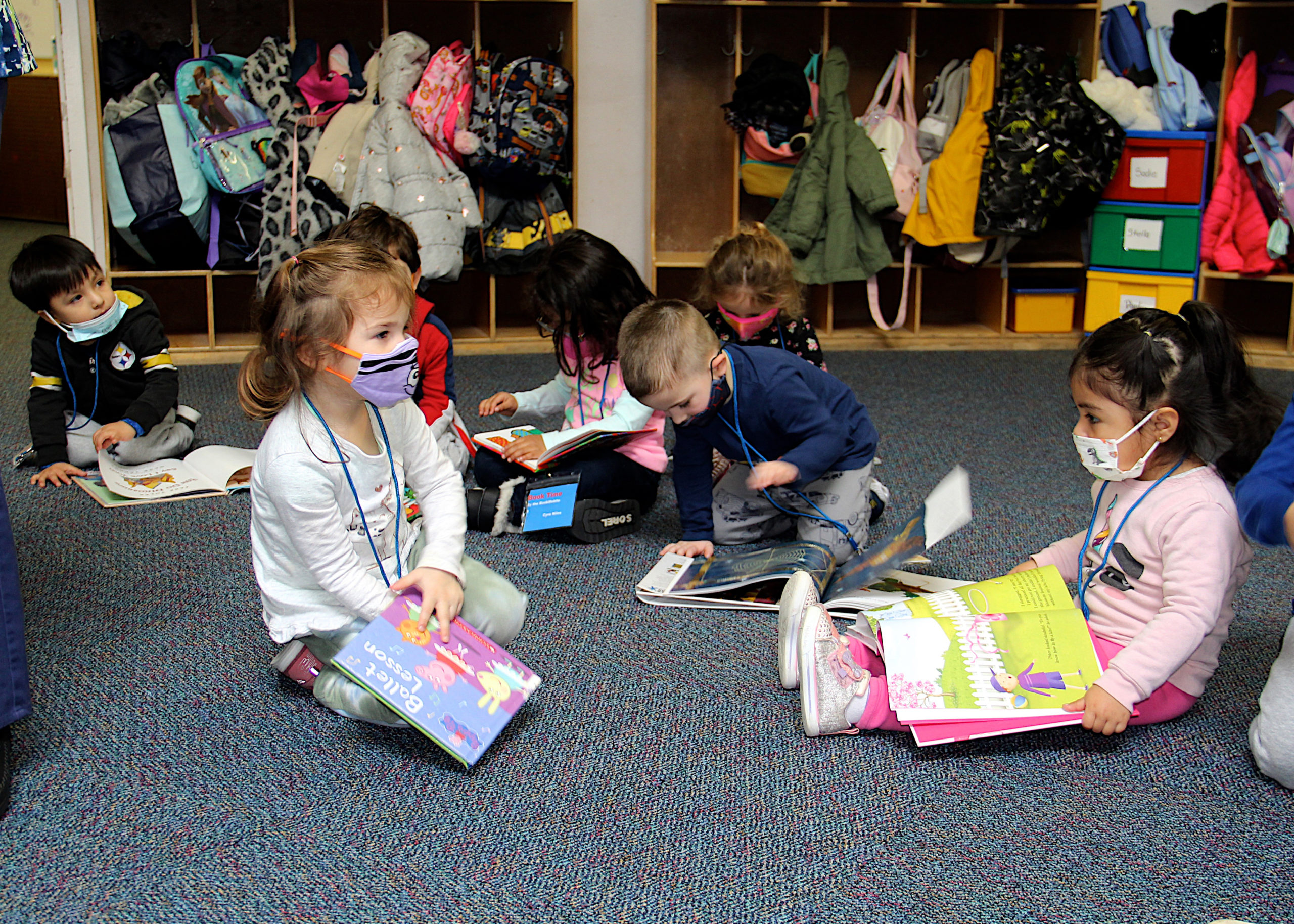 Children enjoy Book Time at the the Eleanor Whitmore Early Childhood Center on Friday.  KYRIL BROMLEY