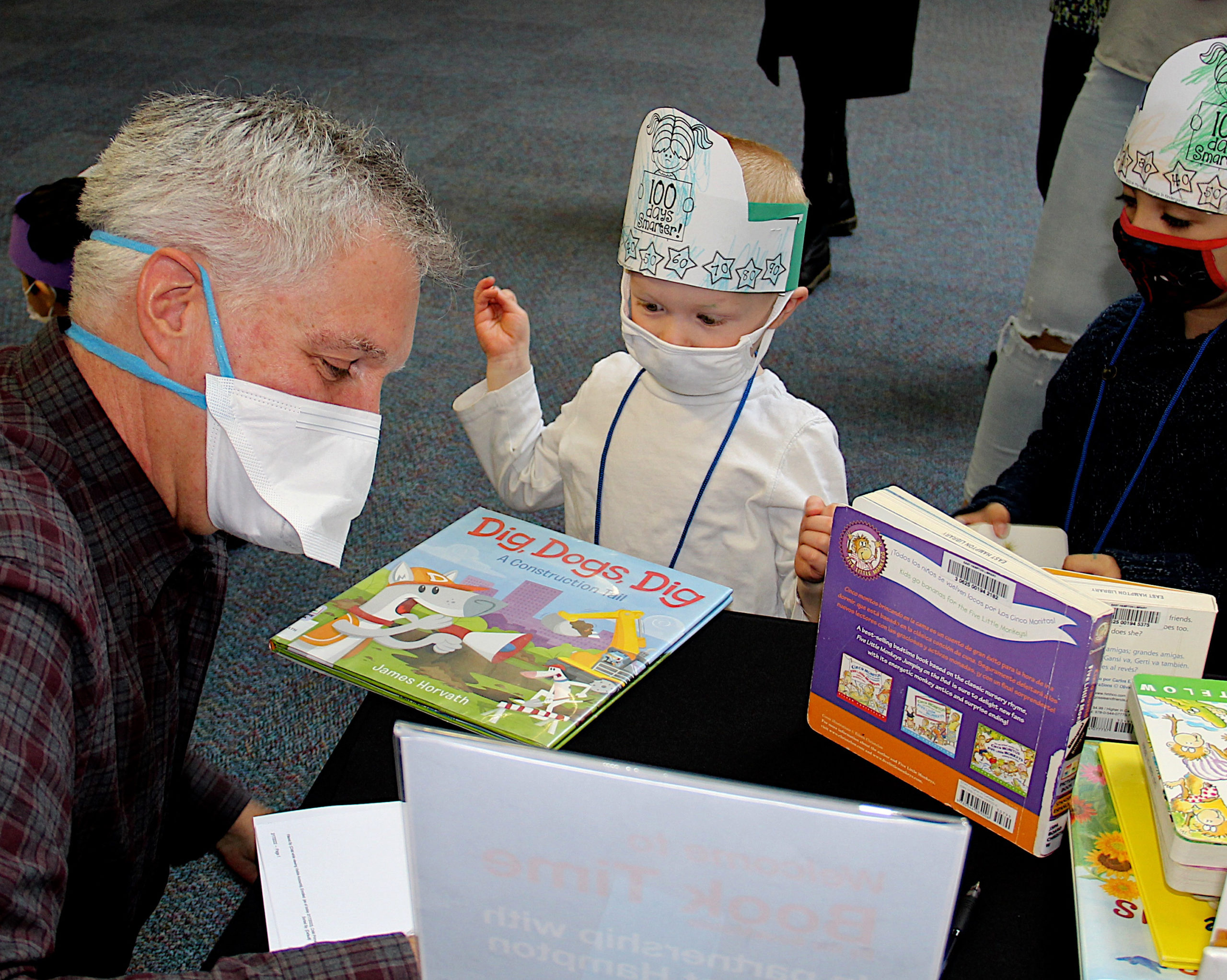 Volunteer John Gicking with Owen Marciniak at Book Time.    KYRIL BROMLEY