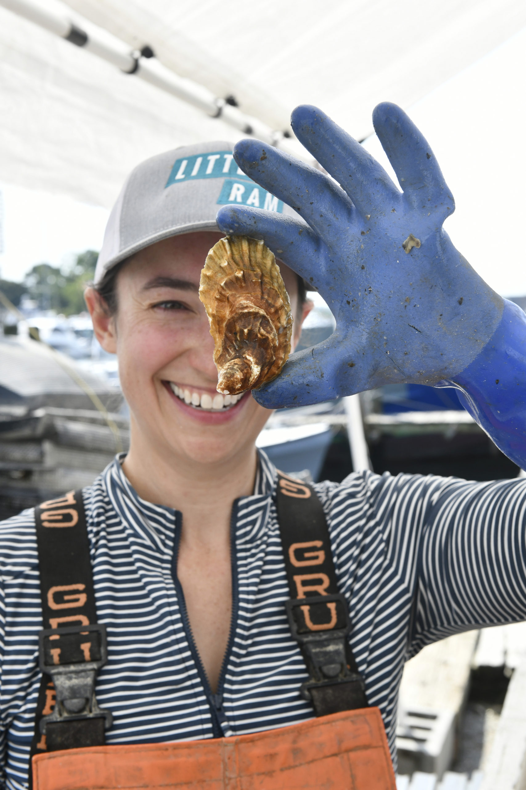 Elizabeth Peebles with one of the freshly caught oysters.  DANA SHAW