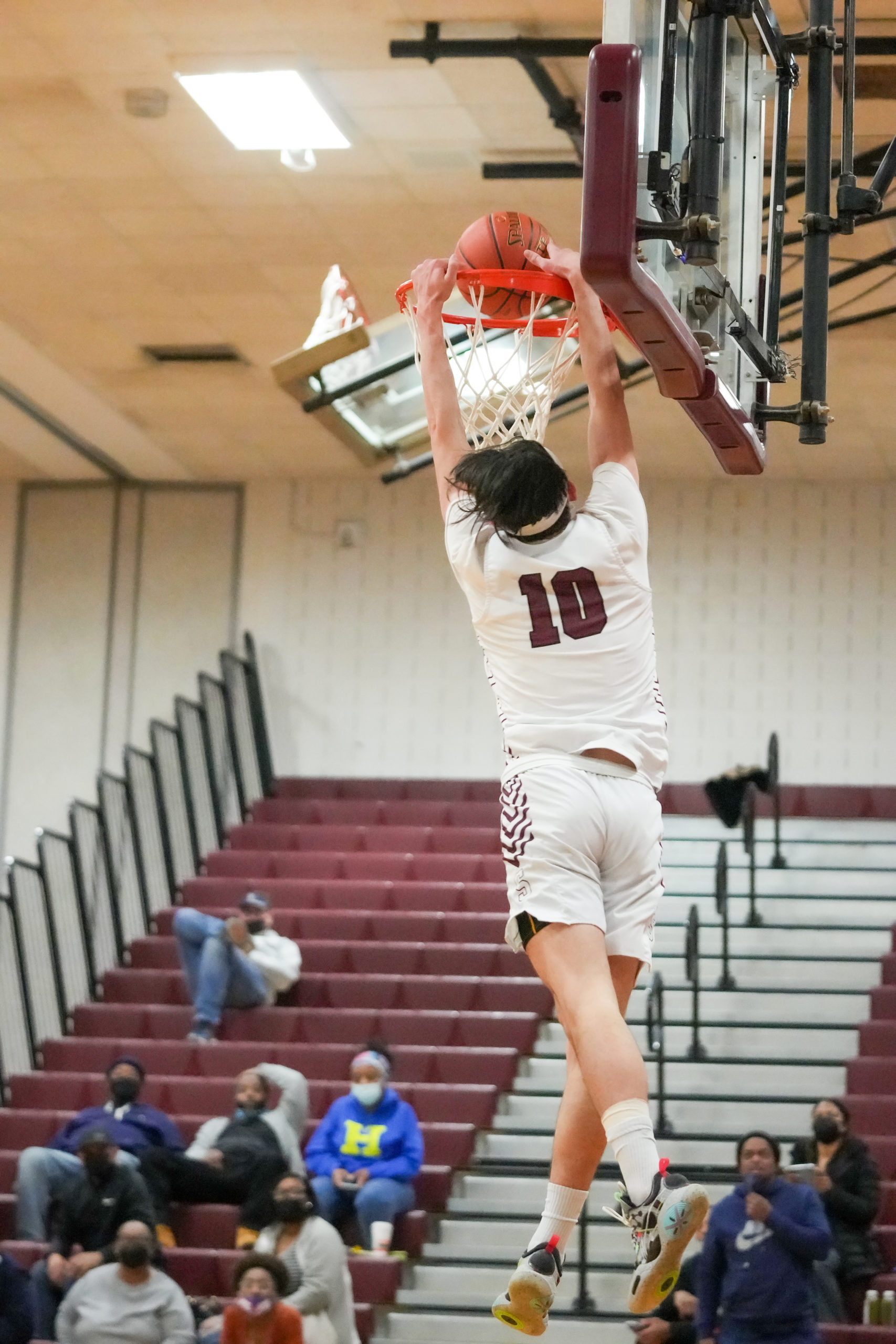 Southampton senior Andrew Venesina caps a fast break with a two-handed dunk.