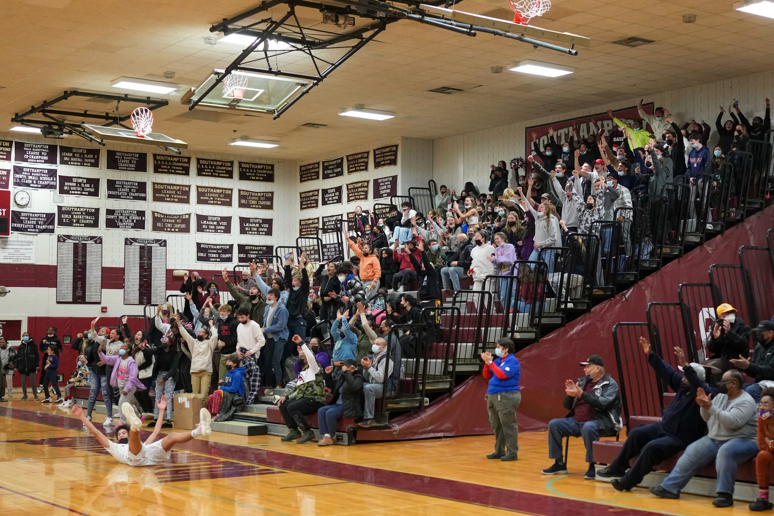 The home crowd erupts when senior Kellen Jeffries nails a three-pointer.