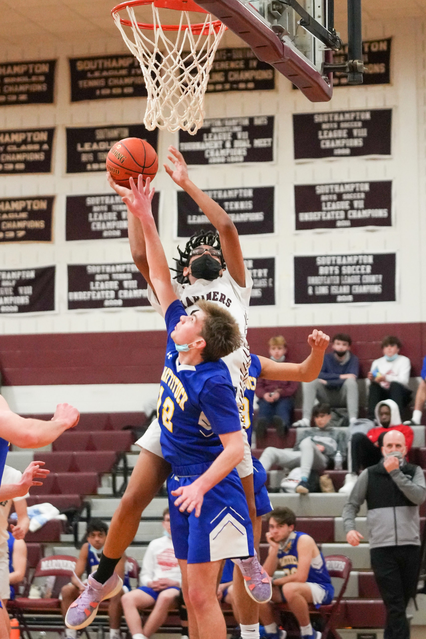 Southampton senior Ryan Smith scores over a Mattituck player.