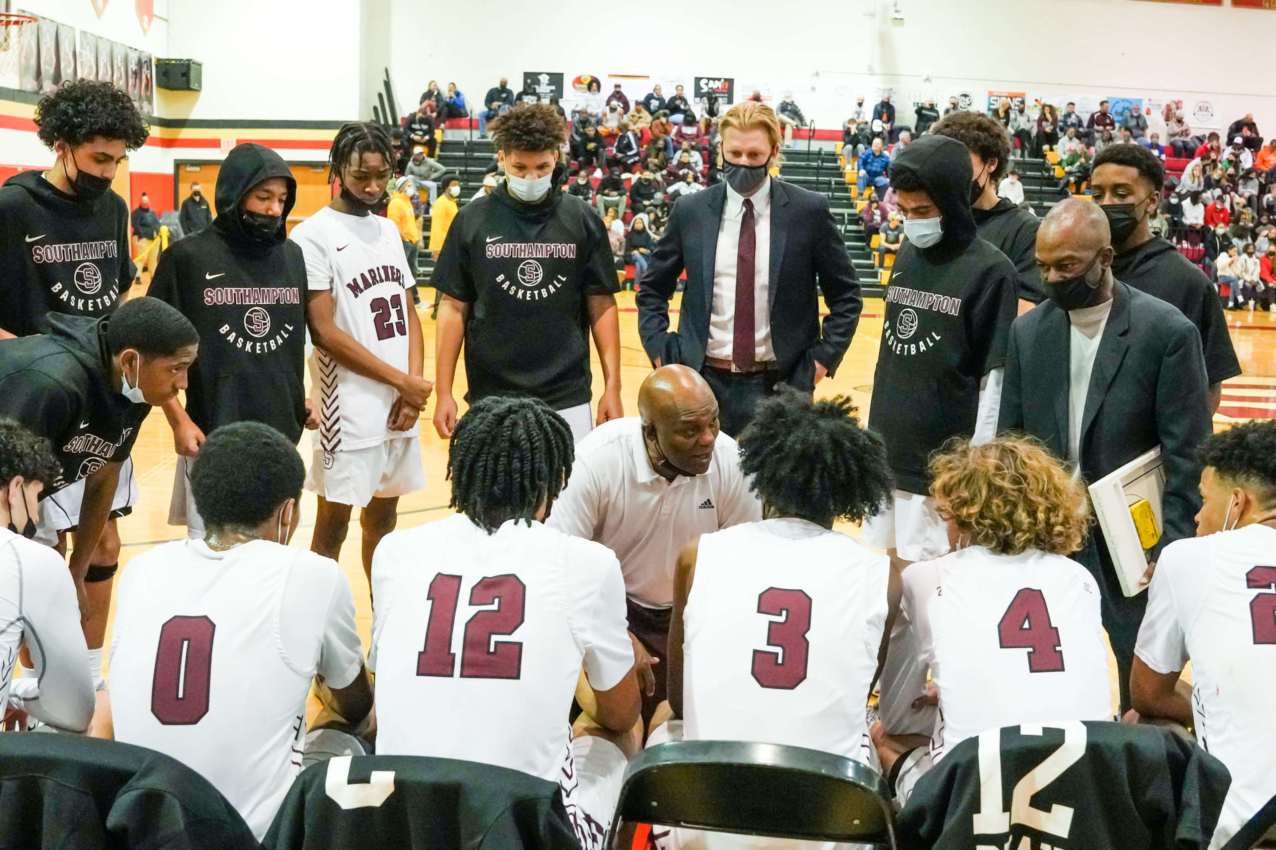 Southampton head coach Herm Lamison talks with his players during a timeout.