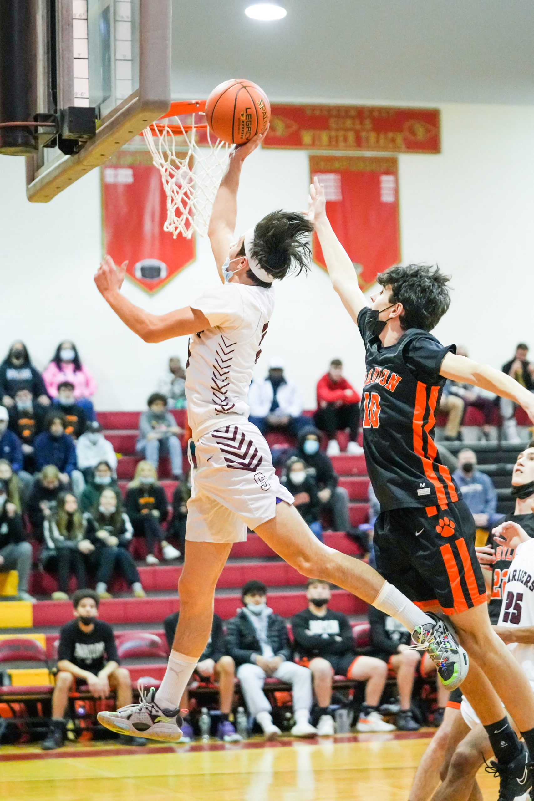 Southampton senior co-captain Andrew Venesina takes on a Babylon defender at the rim.