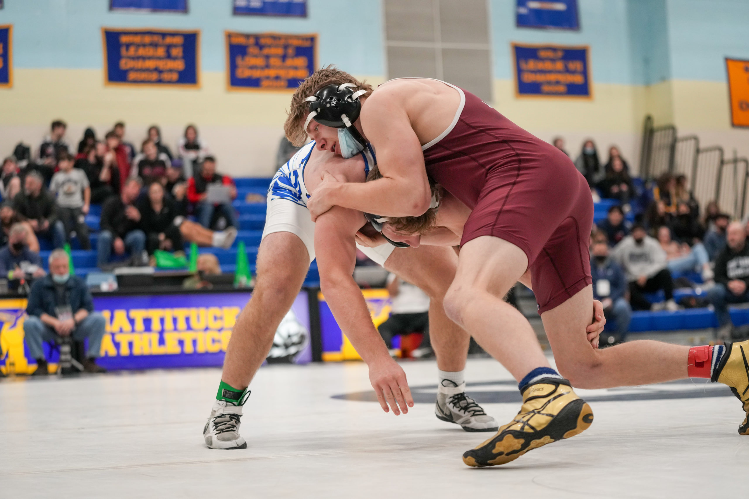 Senior Mariner Brad Bockhaus battles with Glenn's Alon Alkeali in the 189-pound county championship bout. Bockhaus won, 5-4, for his first ever county title.