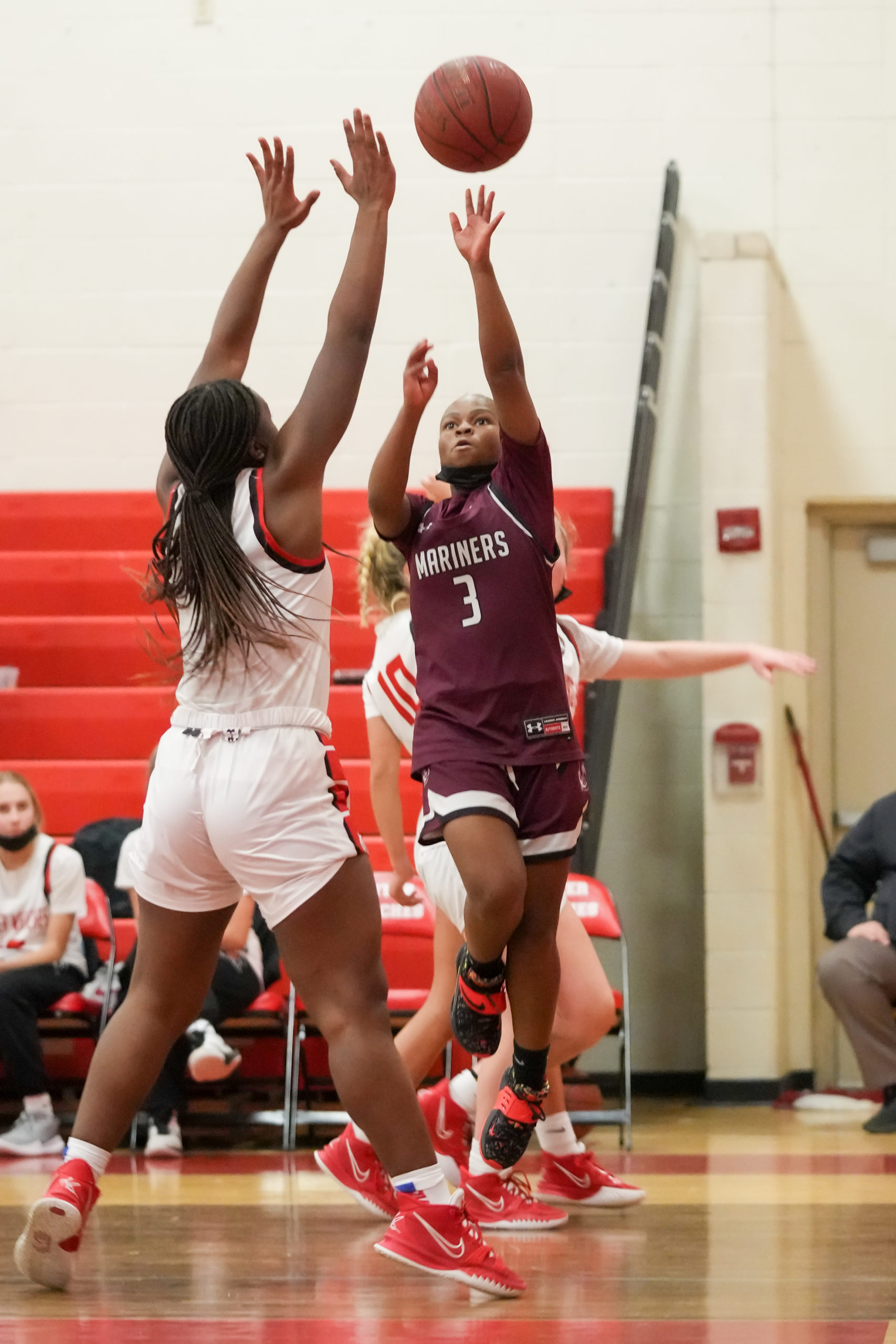 Maddie Taylor tries to score over Climele Browne of Center Moriches.