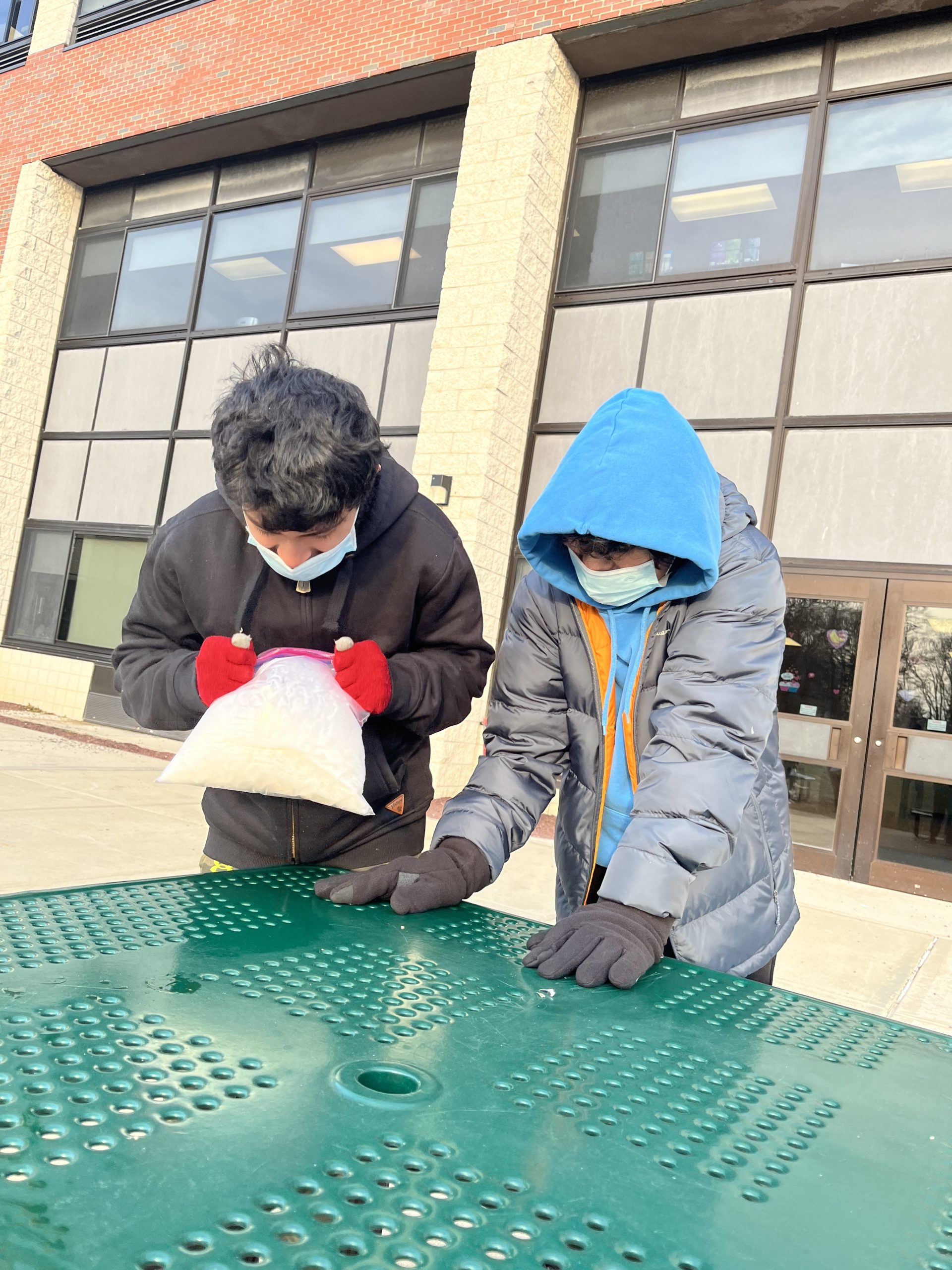 Jillian Stellato’s seventh grade science class at Pierson Middle School has been studying states of matter and phase change. On January 28, in anticipation of the expected weekend's blizzard, the students made ice cream for a hands-on demonstration of phase change, thermal energy and freezing point depression.