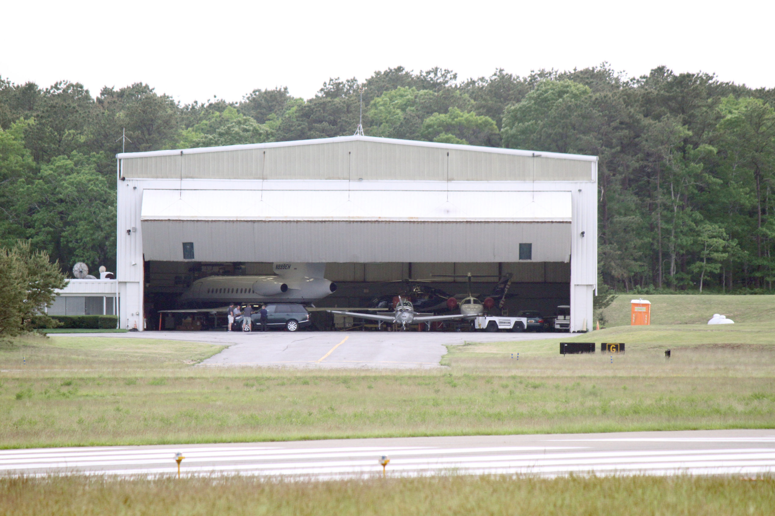 The estate of the late Ben and Bonnie Krupinski, who owned the largest hangar at East Hampton Airport is among the groups that have asked a court to stop the town from closing the airport, even temporarily.
