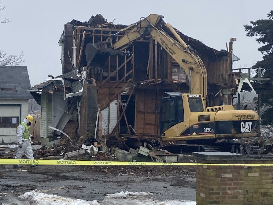 Taking down the blighted Bay Avenue house.