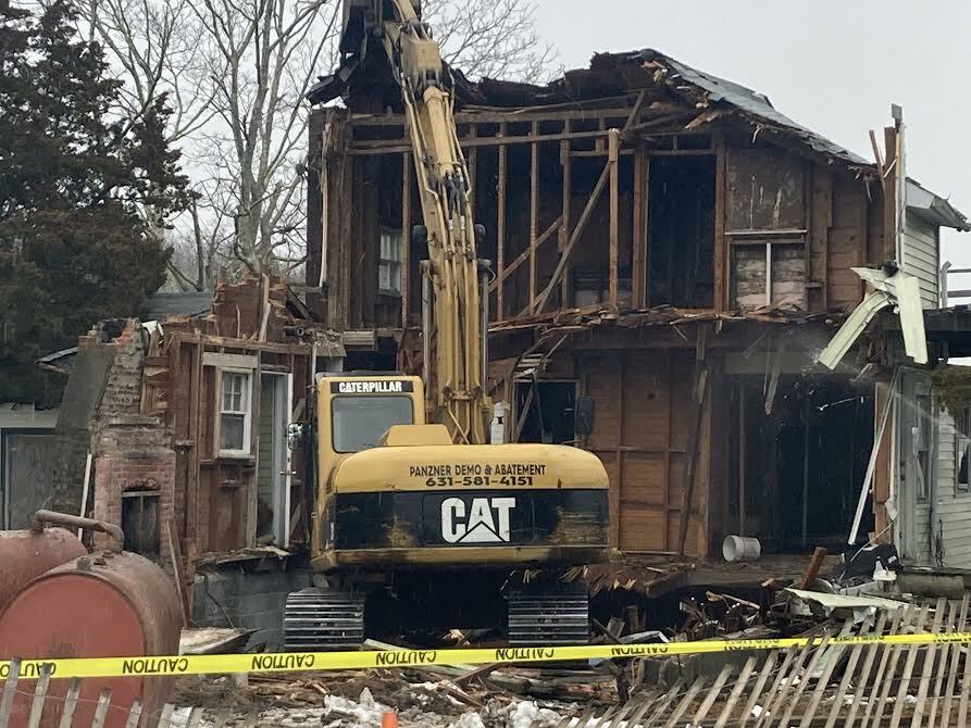 The demolition of the blighted house began Monday morning.