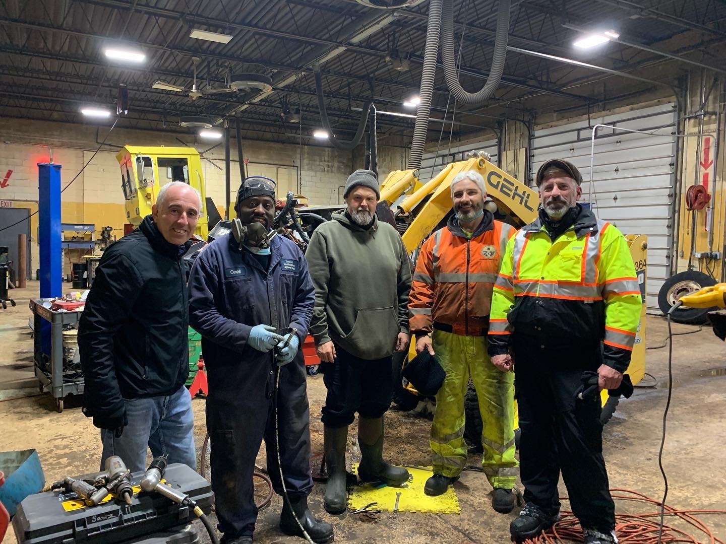 From left, Southampton Town Supervisor Jay Schneiderman with highway department crew members O'Neil Stewart, James Wilson, Mark Pothier, and Highway Superintendent Charlie McArdle. Highway department crew members worked for two days with very few breaks and were still working on the roads on Monday morning.