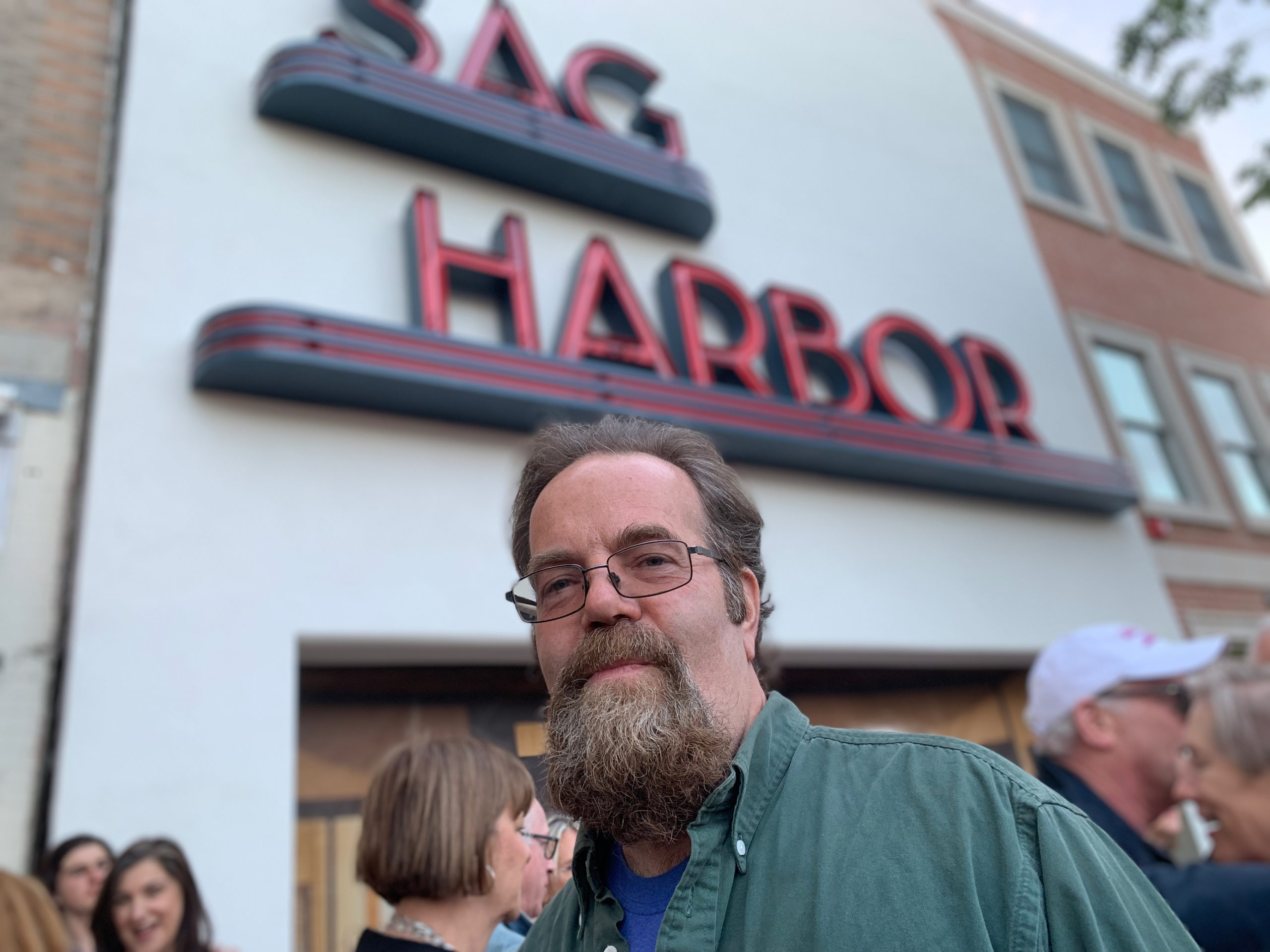 Neon artist Clayton Orehek during the 2019 relighting of the Sag Harbor Cinema sign. ANNETTE HINKLE