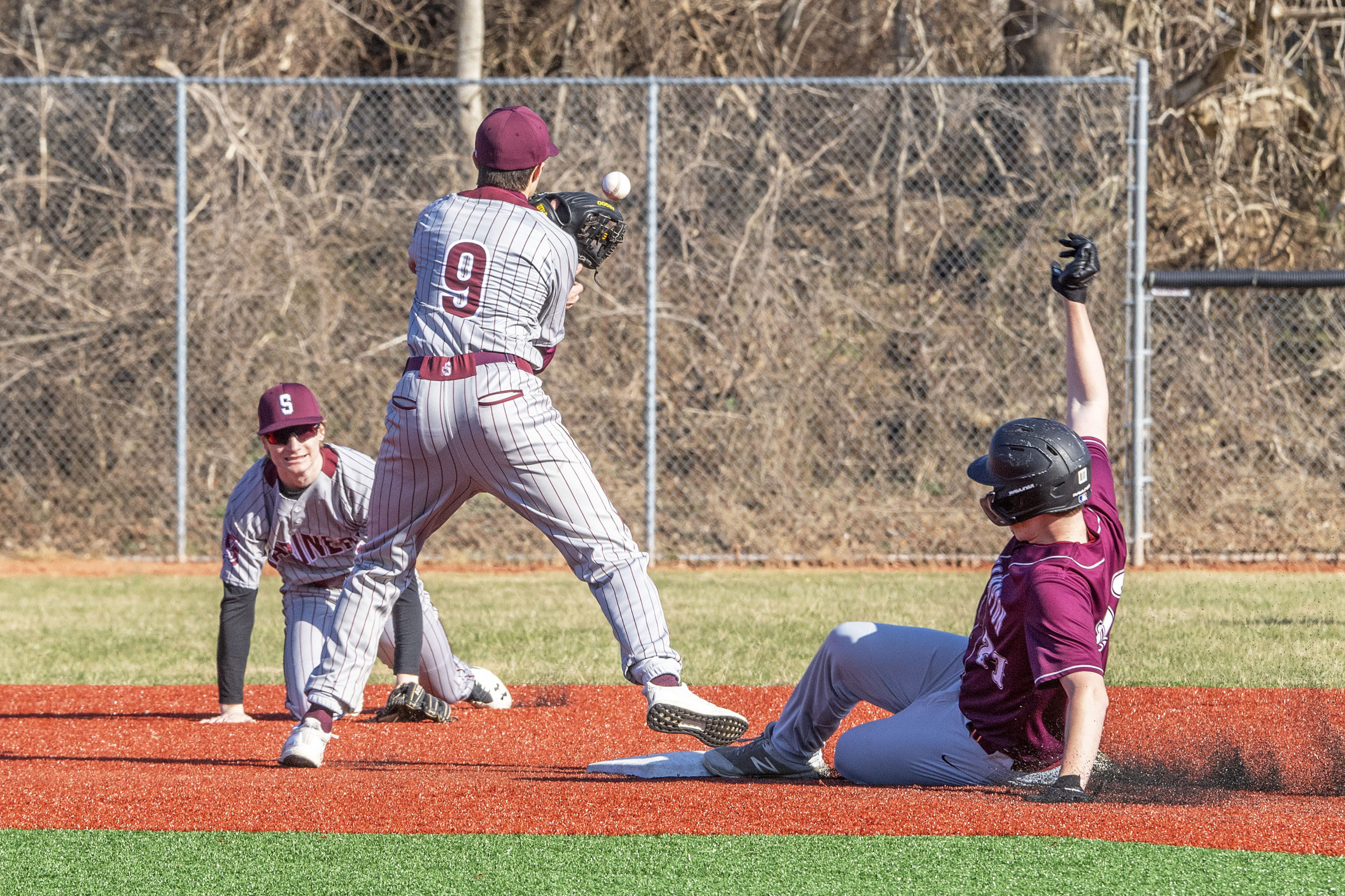 Southampton's Zack Valk gets the throw a fraction of a second too late to prevent a Bonacker to steal second base.   MICHAEL HELLER