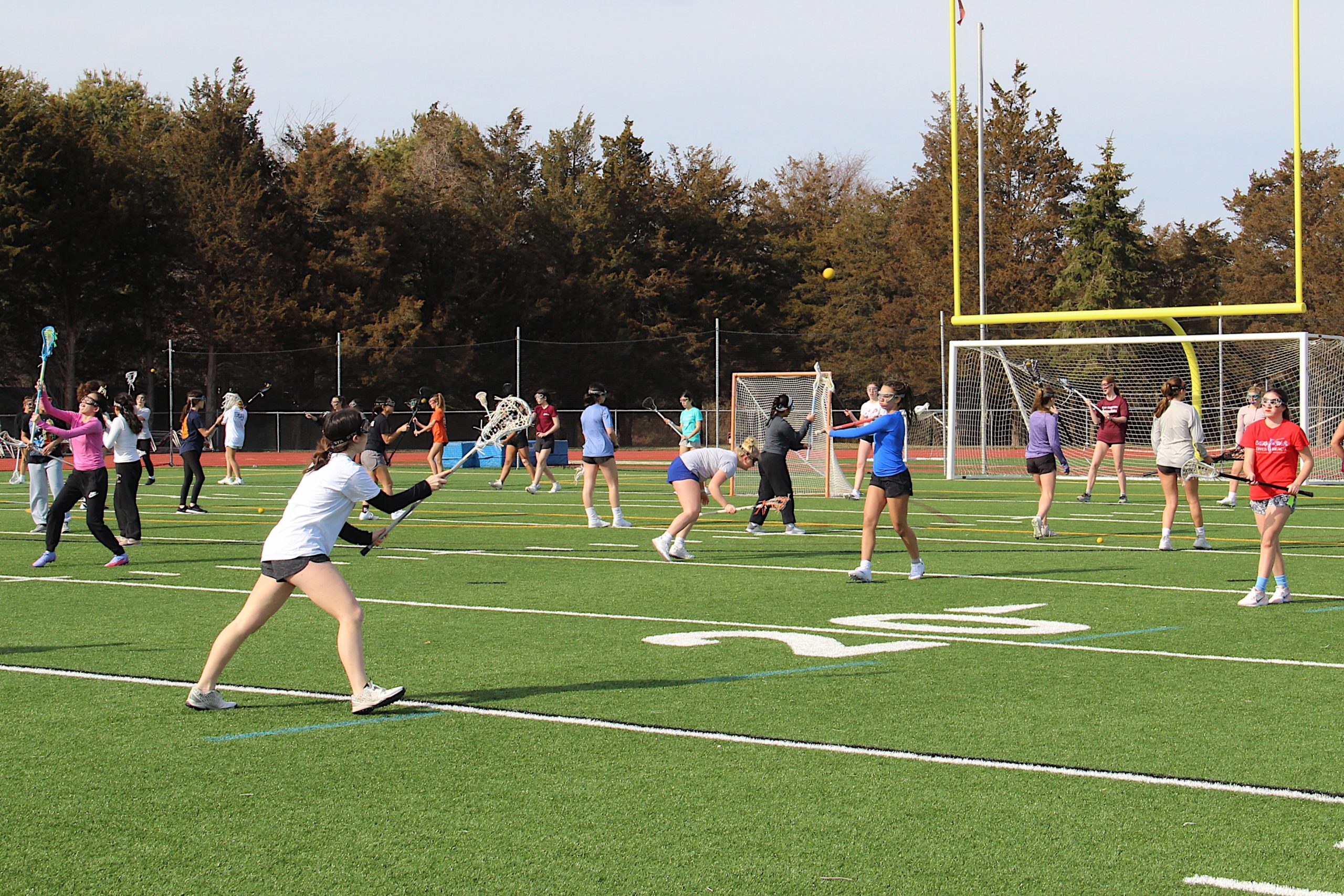 The East Hampton/Pierson/Bridgehampton/Ross girls lacrosse team during one of the first official days of the spring season last week.    KYRIL BROMLEY