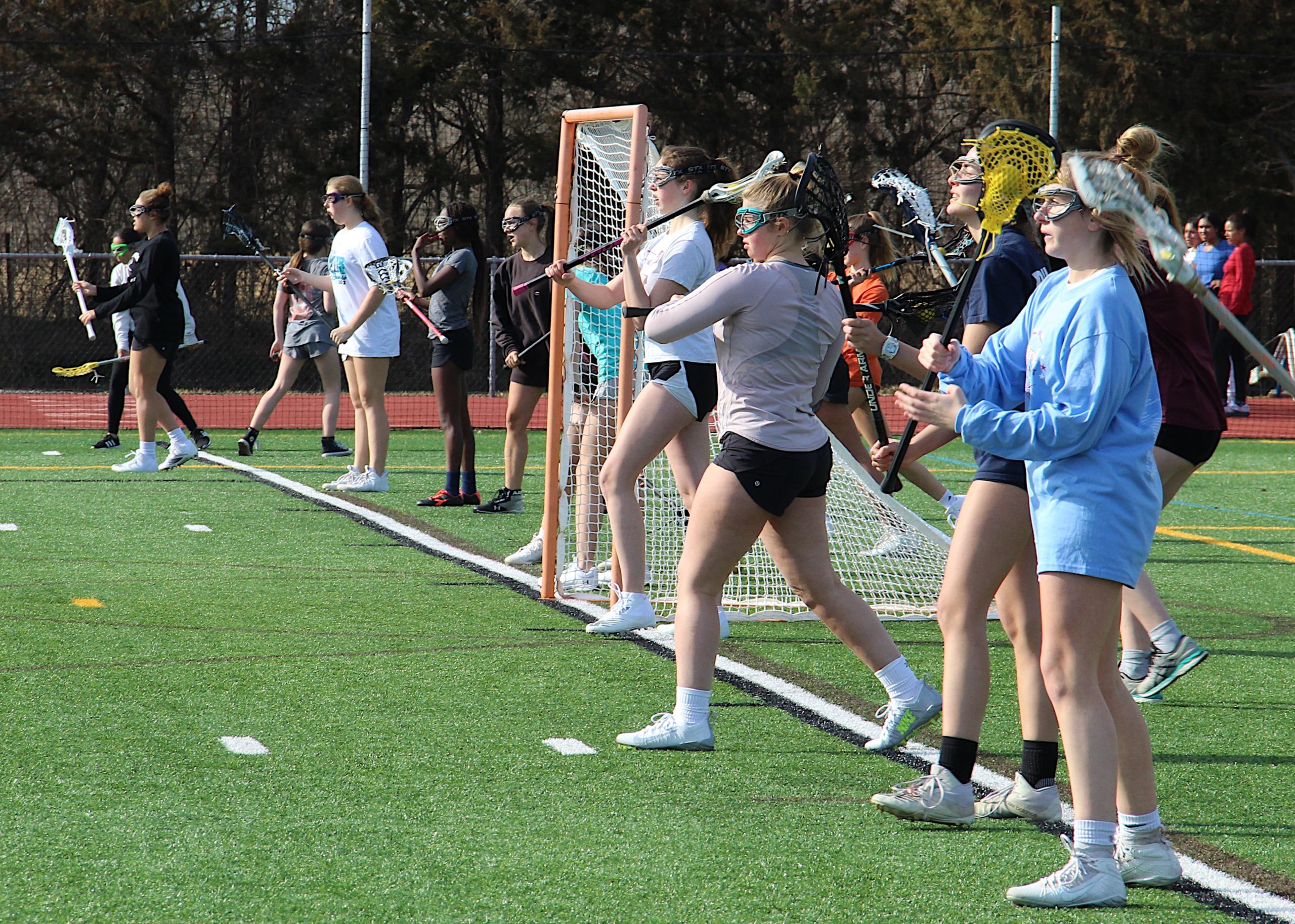 The East Hampton/Pierson/Bridgehampton/Ross girls lacrosse team during one of the first official days of the spring season last week.    KYRIL BROMLEY