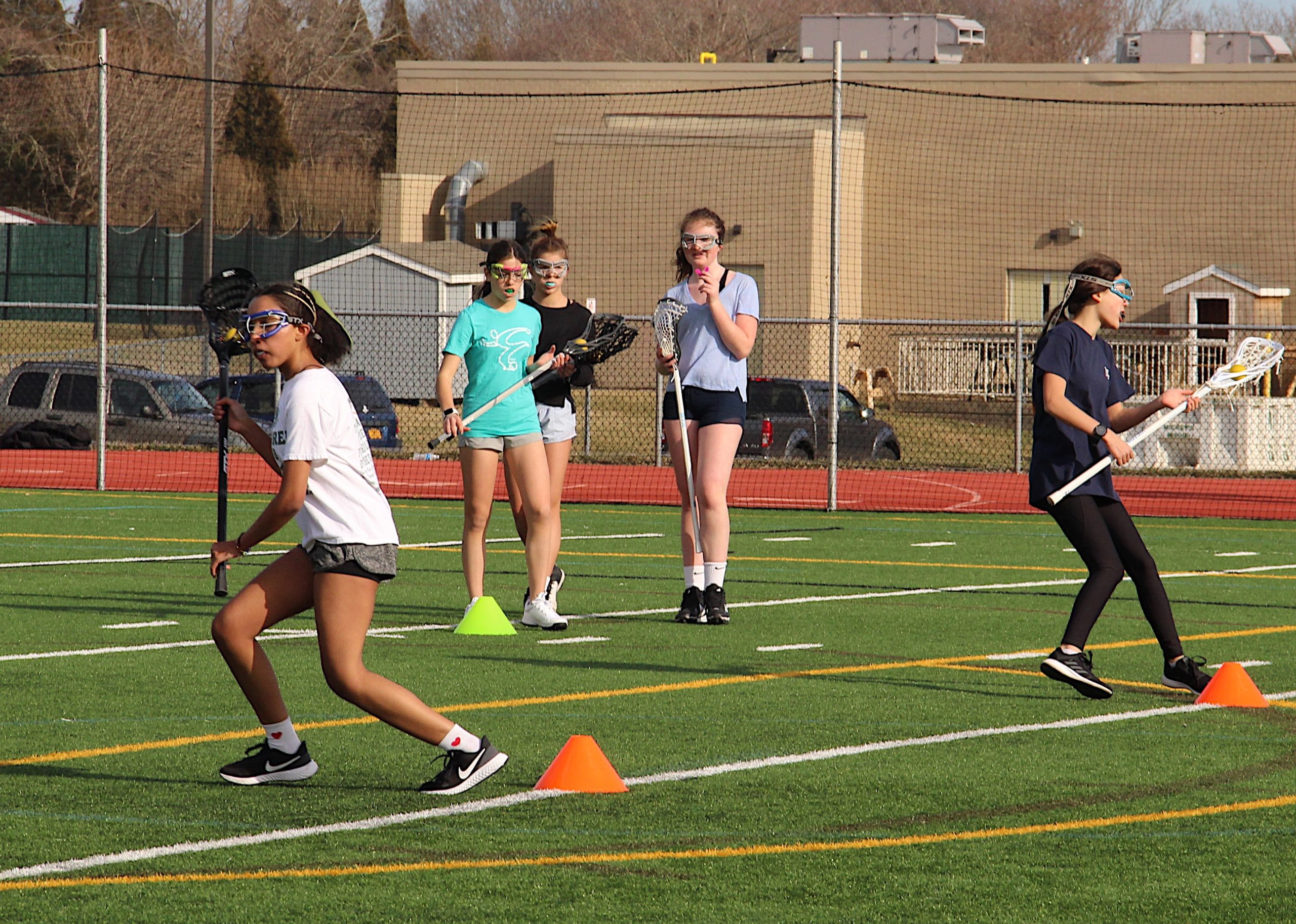 The East Hampton/Pierson/Bridgehampton/Ross girls lacrosse team during one of the first official days of the spring season last week.    KYRIL BROMLEY