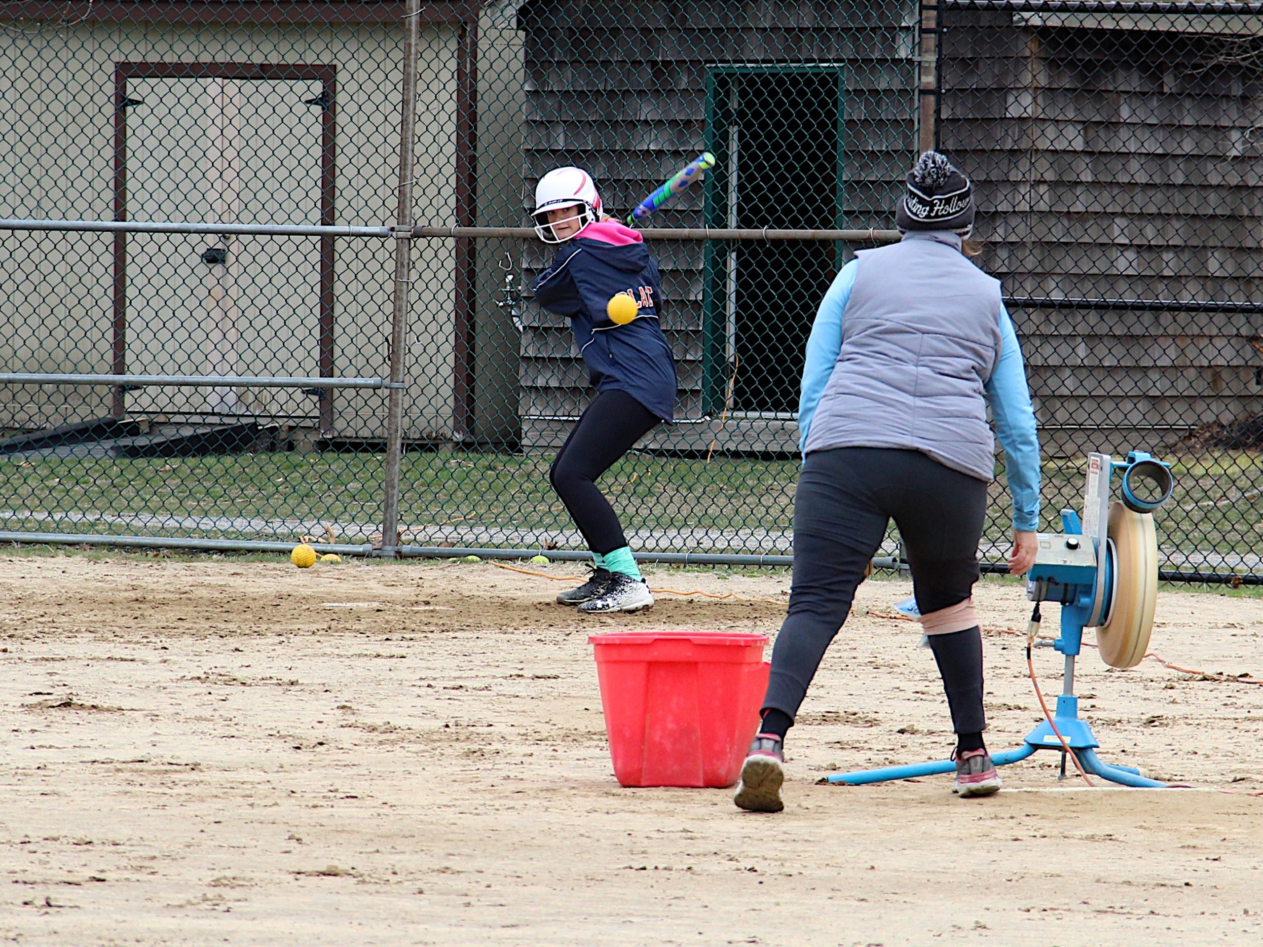 Coach Sharon Truland leads batting practice Saturday morning.   KYRIL BROMLEY