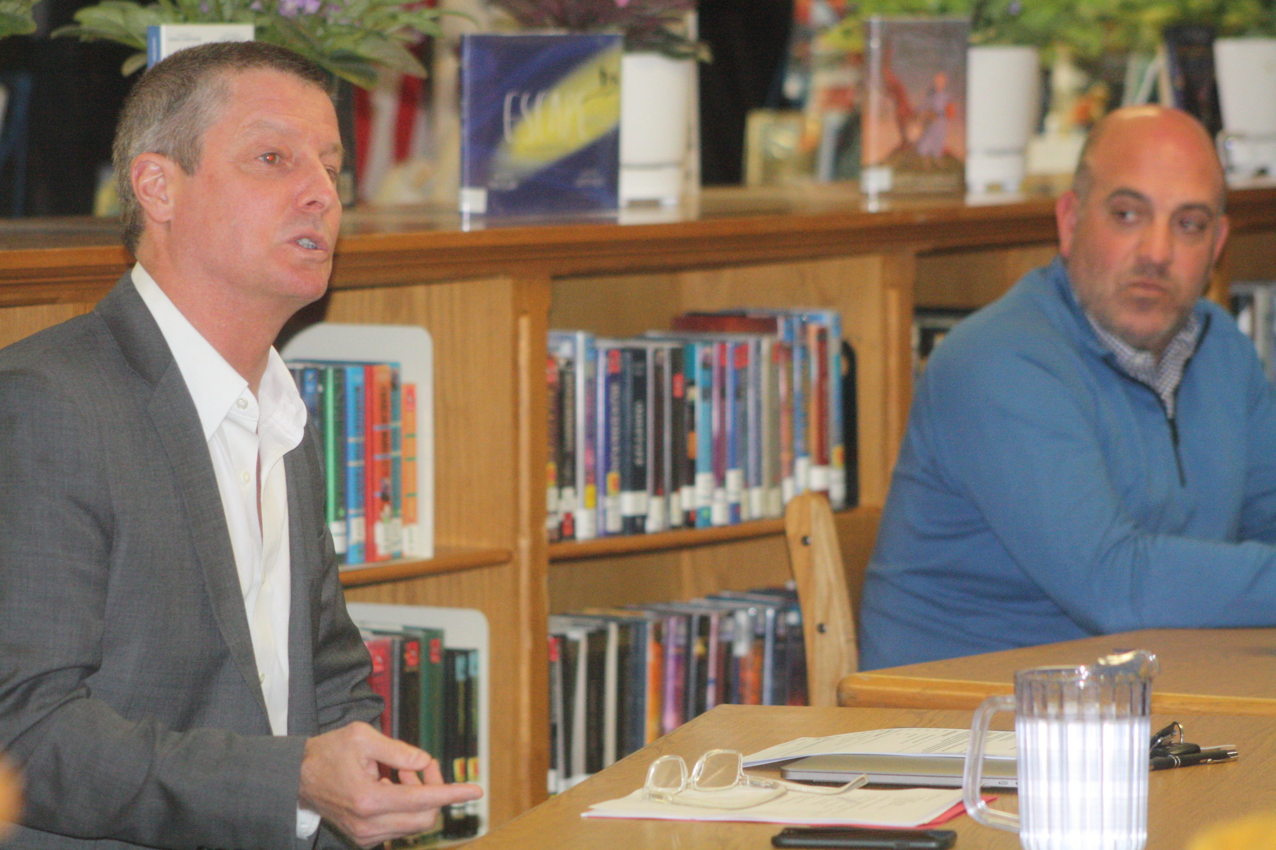 Sag Harbor Schools Superintendent Jeff Nichols, left, and board of education president Brian DeSesa, right, at Monday night's meeting. It was the first in-person (hybrid) meeting in several months in the district.