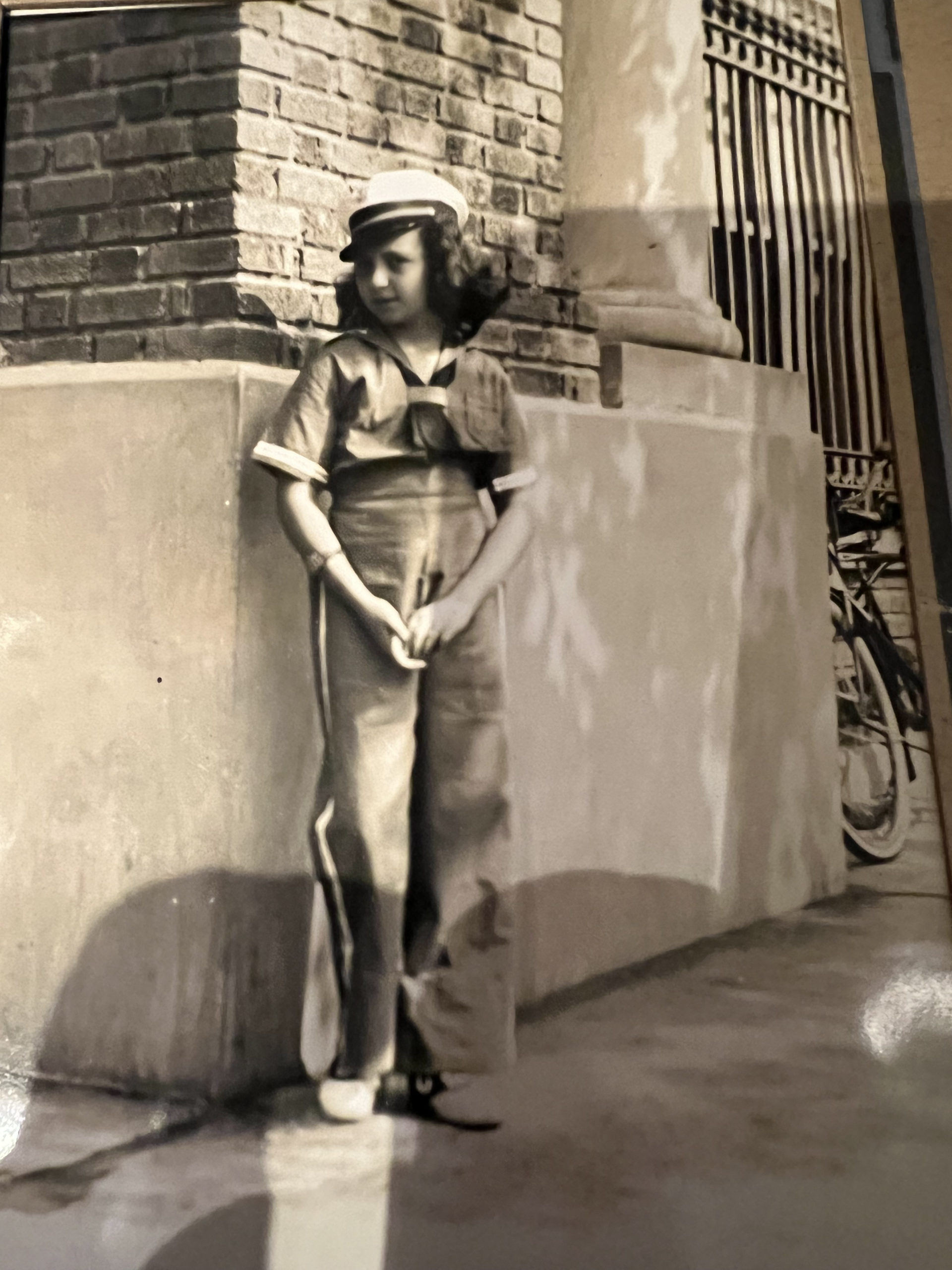 Gertrude Katz as a child in front of what is now the Apple Bank in Sag Harbor.