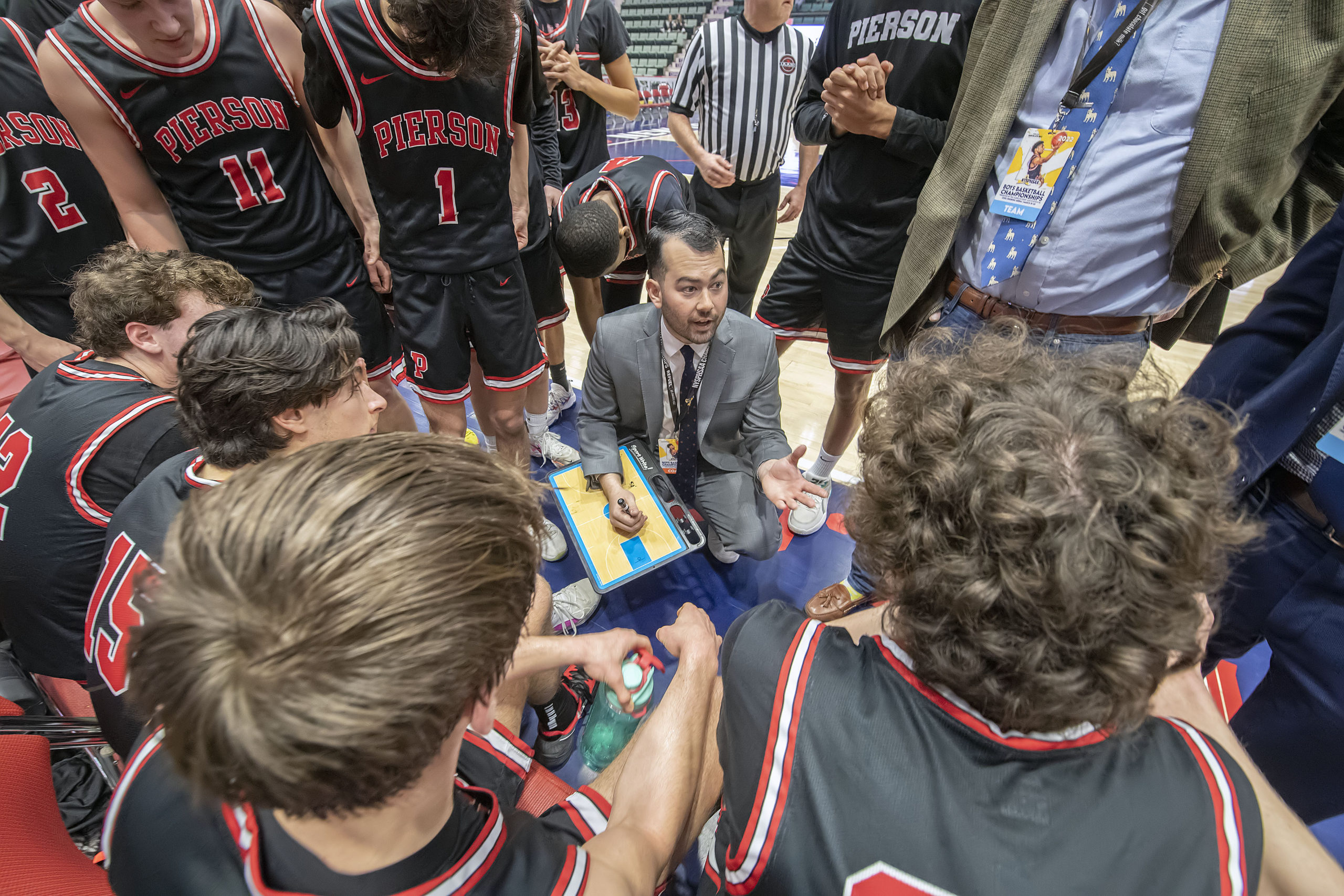 Pierson head coach Will Fujita draws up a play late in the game.    MICHAEL HELLER