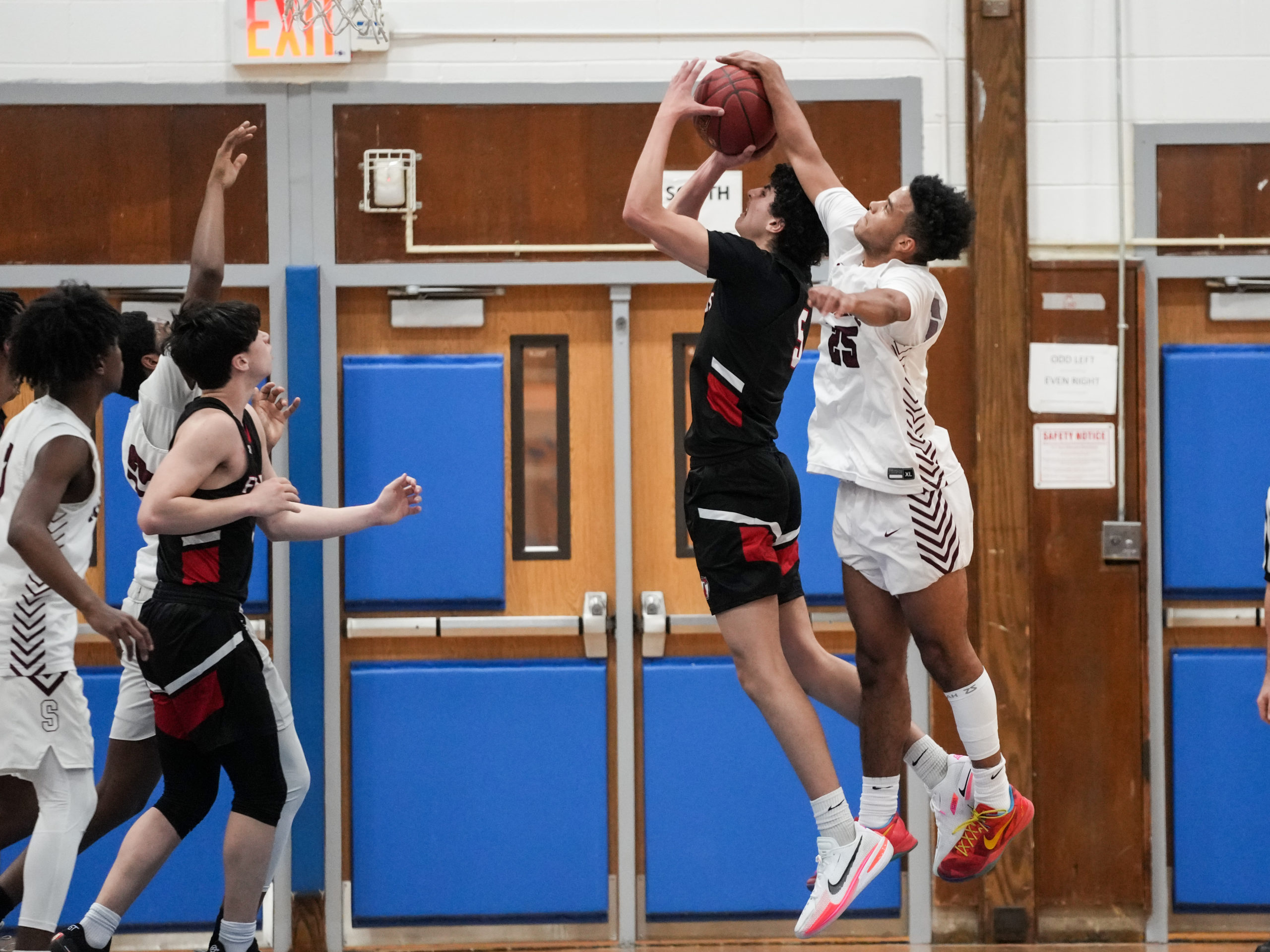 LeBron Napier blocks Quaker Ziad Ashmawy.   RON ESPOSITO