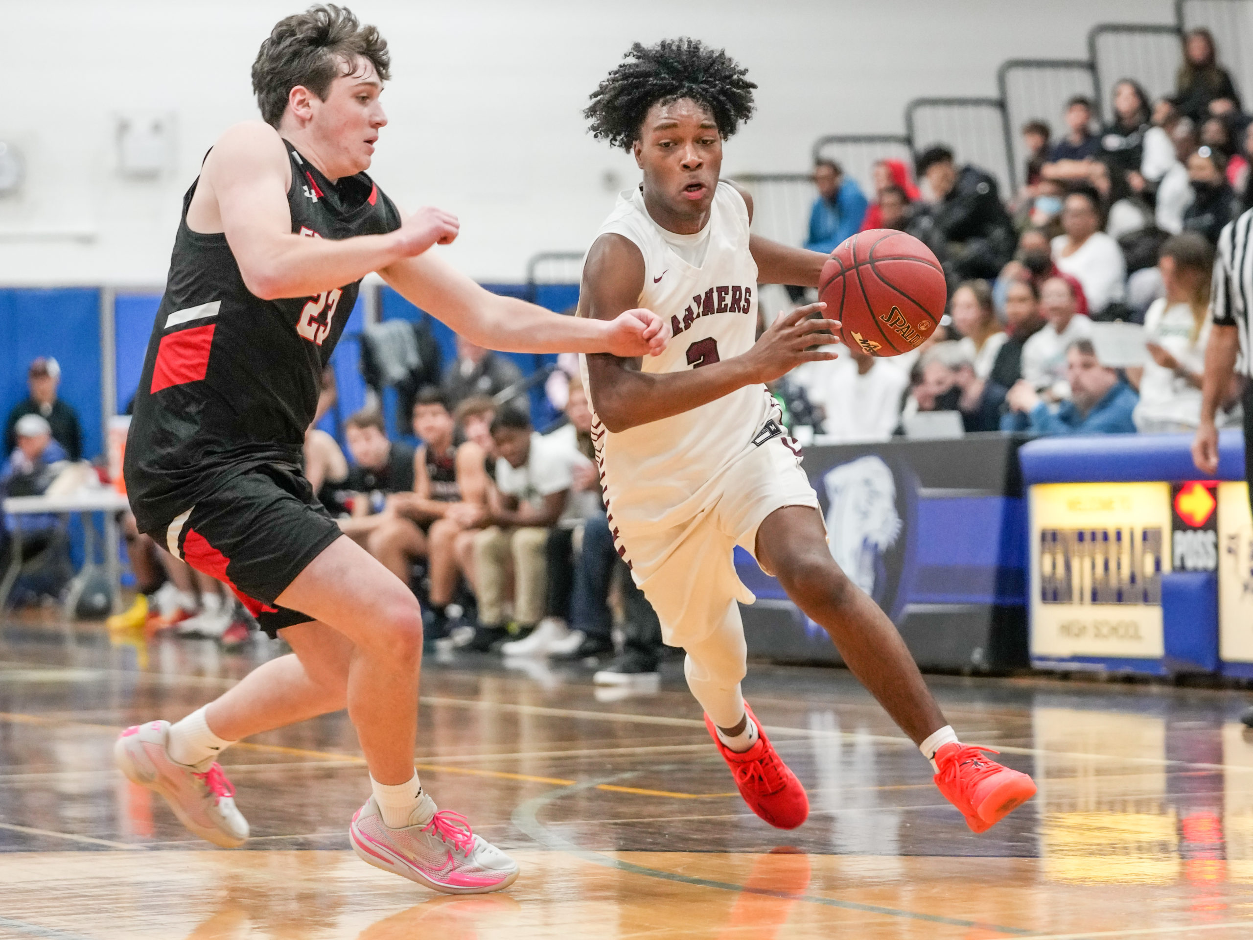 Southampton junior Derek Reed drives on Jake Bock of Friends Academy.    RON ESPOSITO