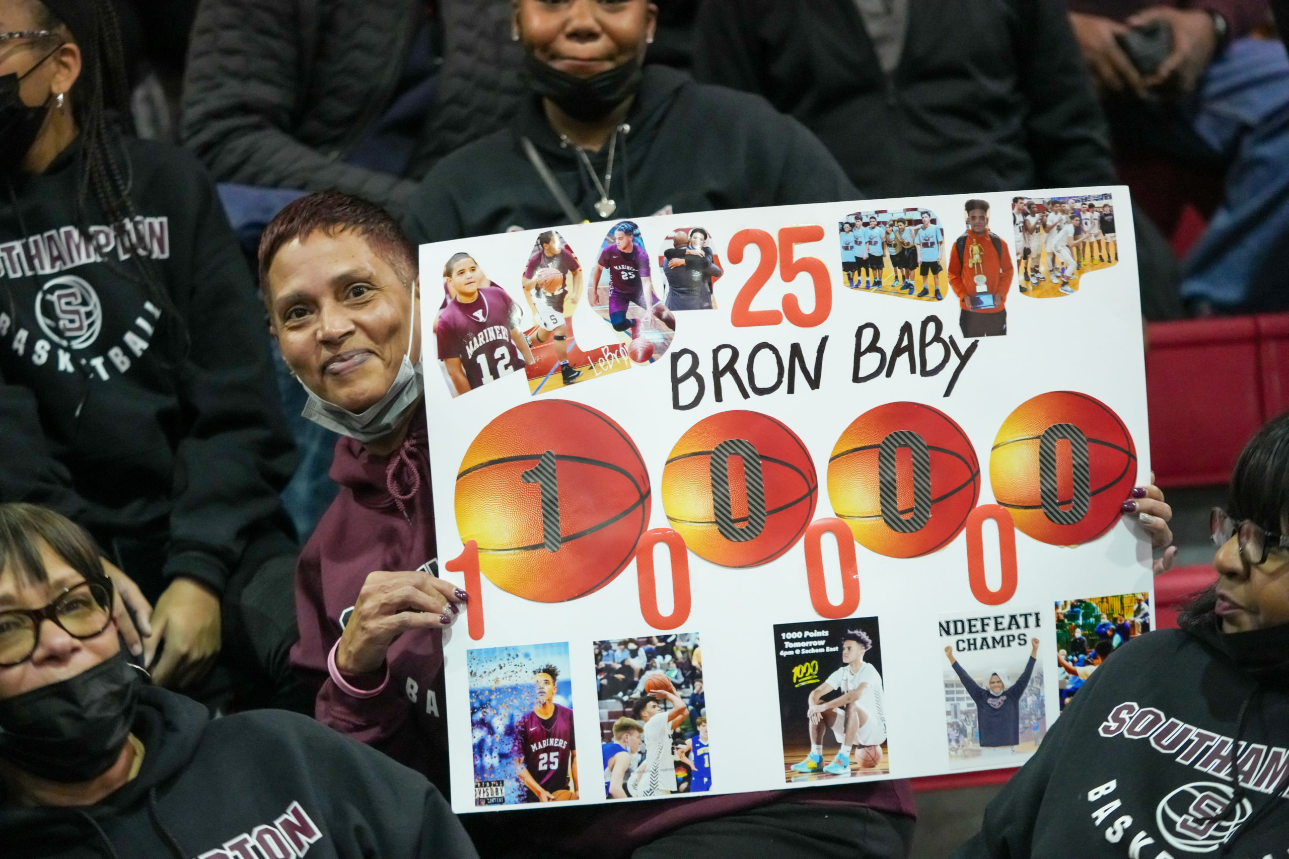 Triste Napier holds up a poster of her son, LeBron.   RON ESPOSITO