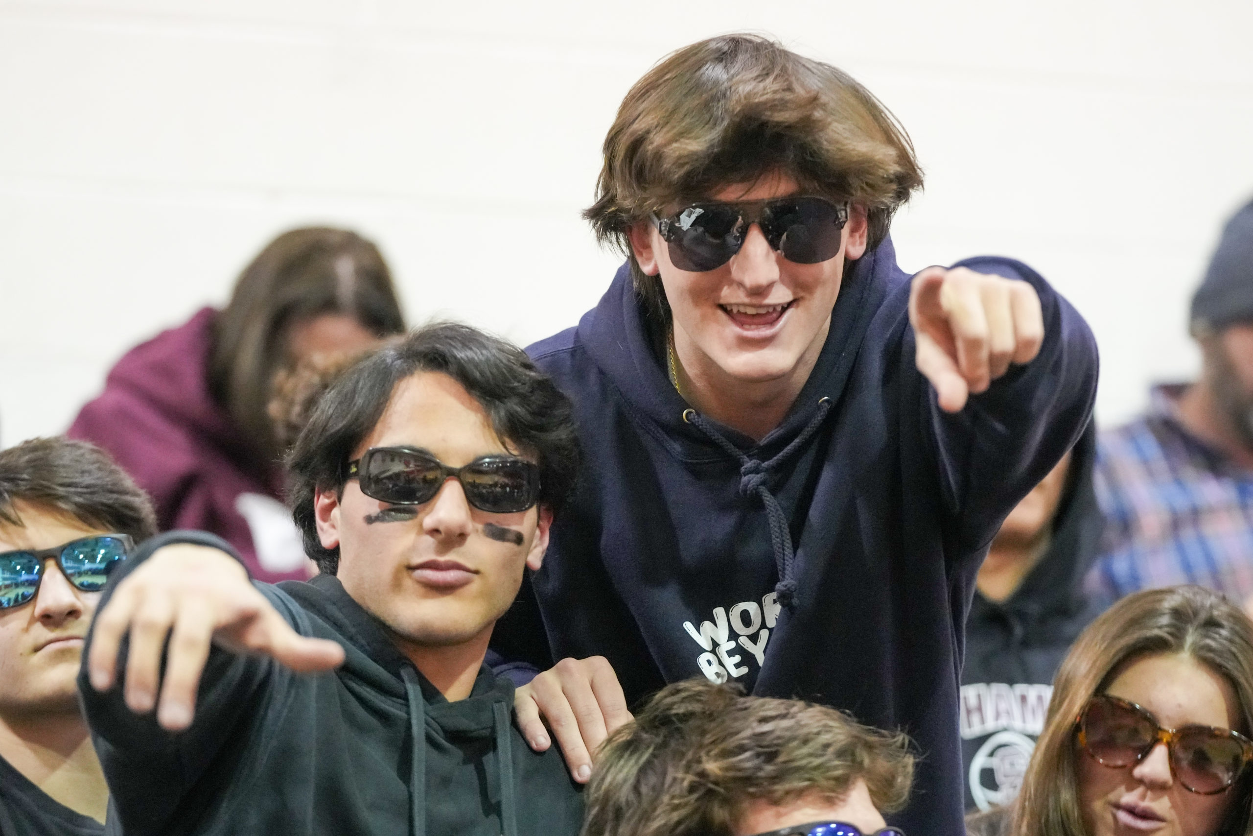 Harrison Gavalas, left,  watch as their Southampton boys basketball team takes on Kings Park in the Small Schools Championship on Friday night.