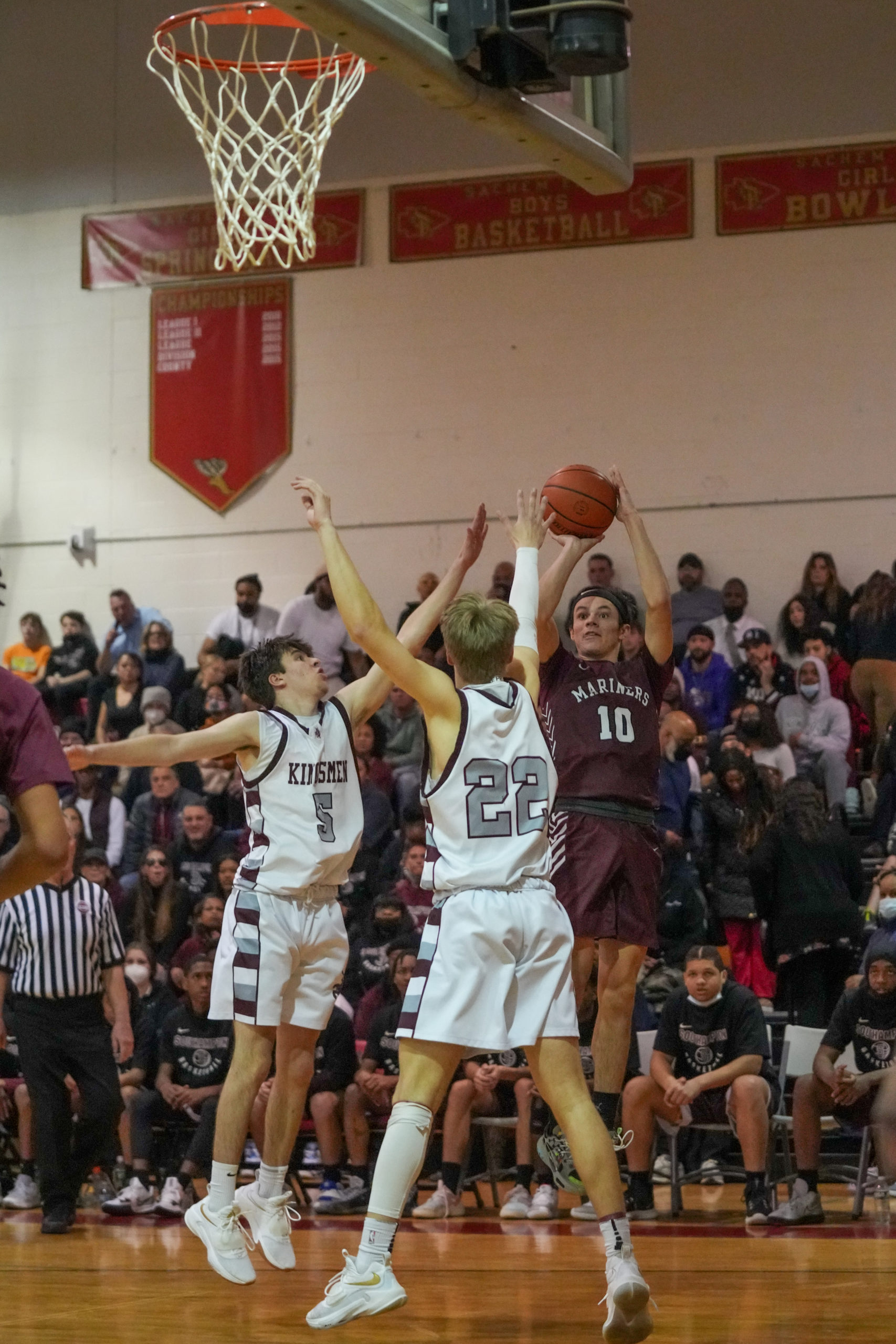 Southampton senior Andrew Venesina tries to shoot over a pair of Kings Park defenders. RON ESPOSITO