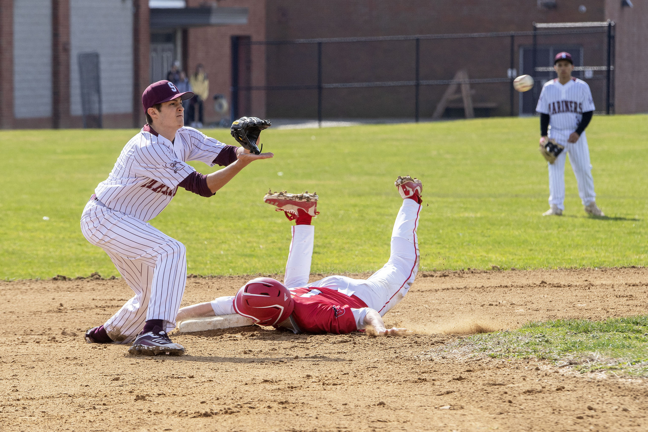 Pierson's Vincent Cavaniola beats the throw to steal second base.   MICHAEL HELLER