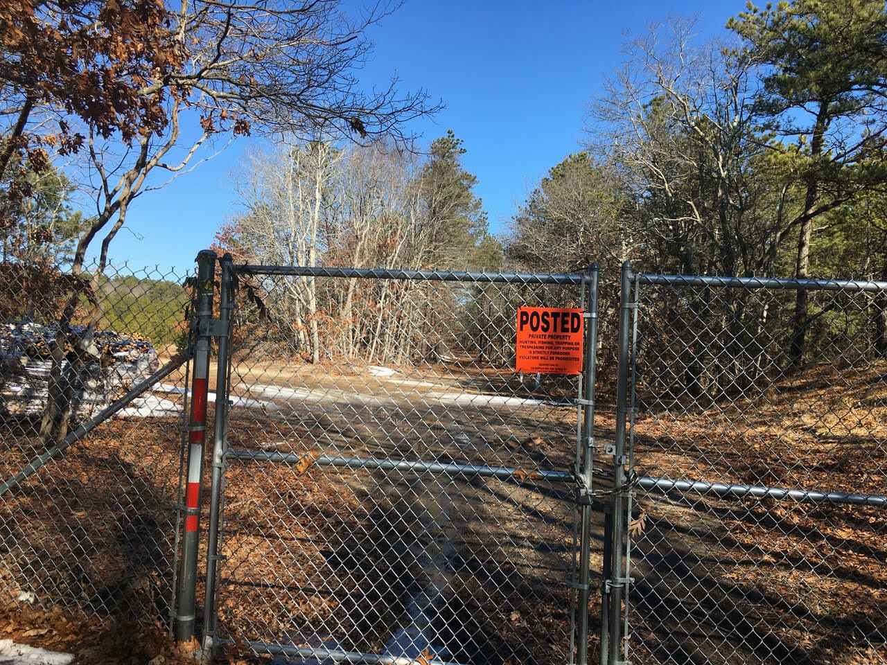 Planners want details about the fence closing off Spinney Road to the public.