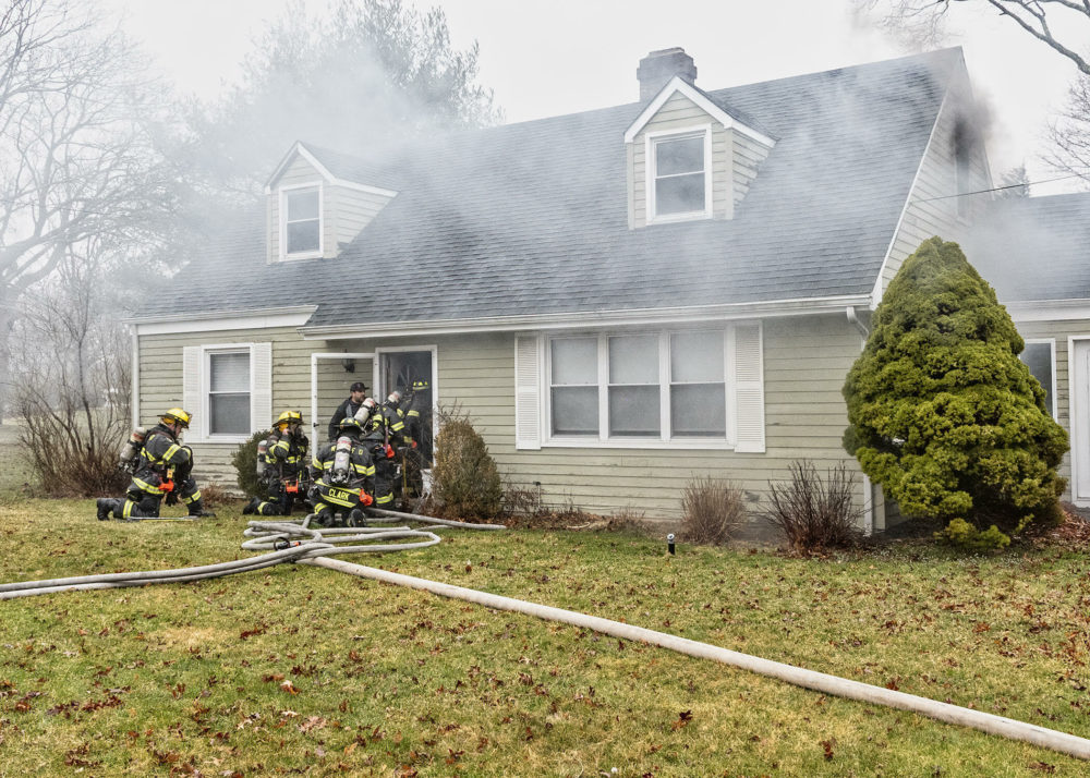 Firefighters begin to enter the Griffing Avenue house in Westhampton.    COURTESY WESTHAMPTON BEACH FIRE DEPARTMENT