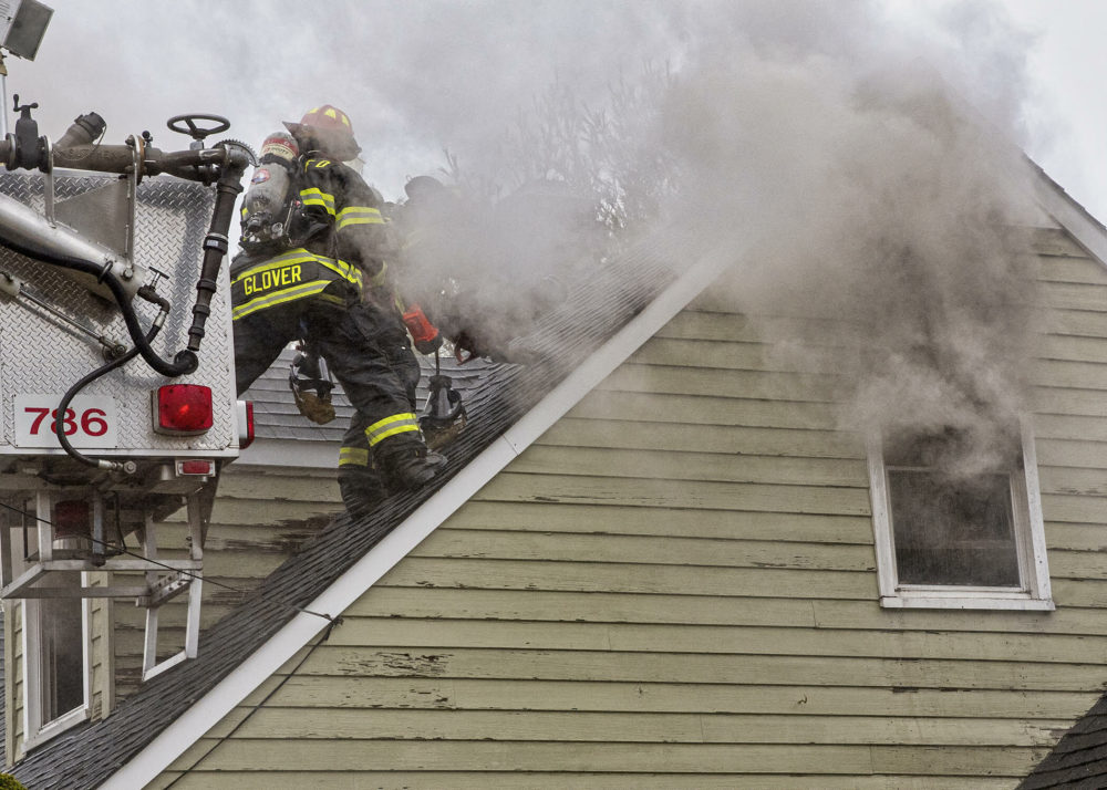 Firefighters vent the roof. COURTESY WESTHAMPTON BEACH FIRE DEPARTMENT