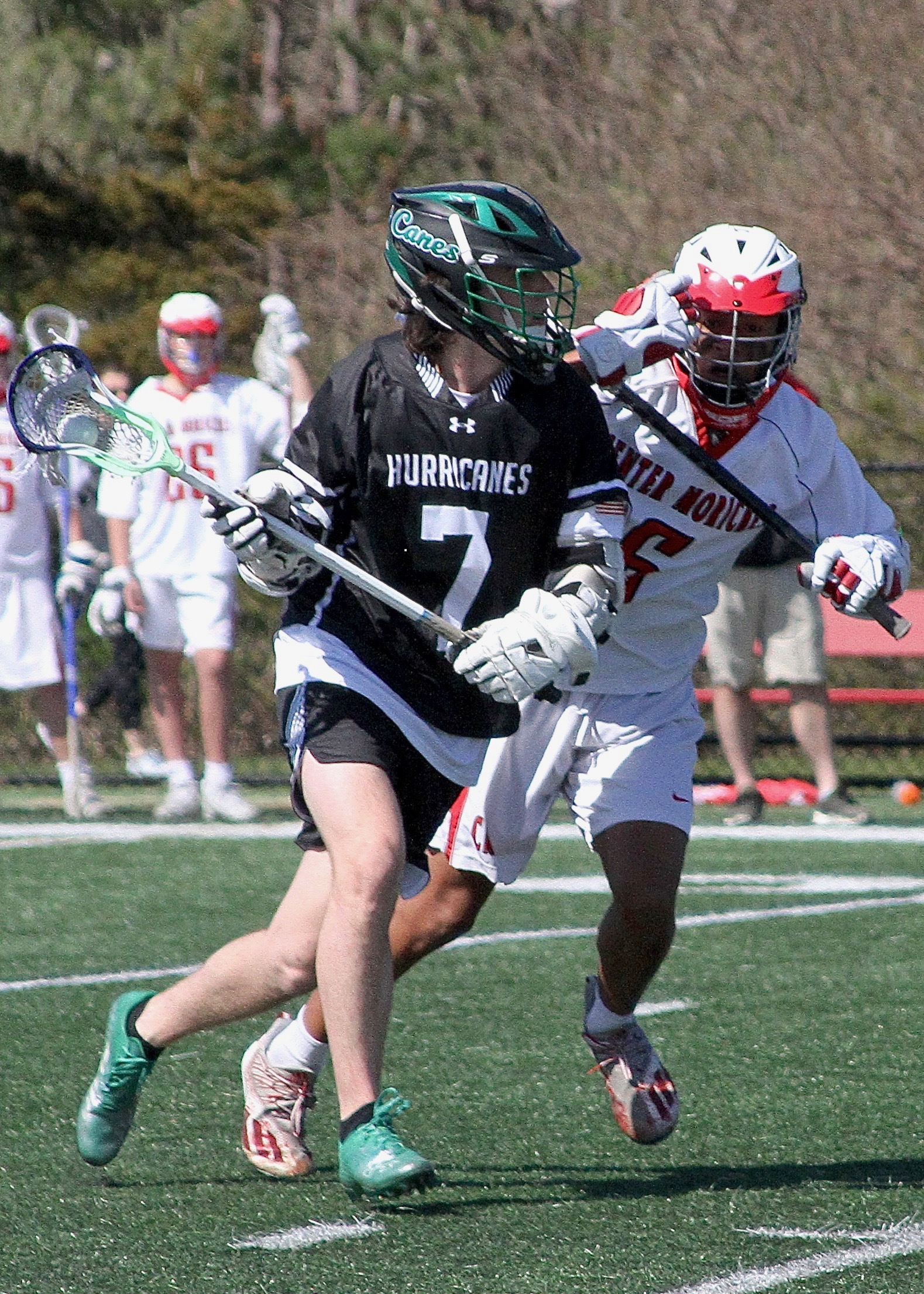 Senior midfielder Aidan Kellachan carries the ball into Center Moriches' zone. DESIRÉE KEEGAN