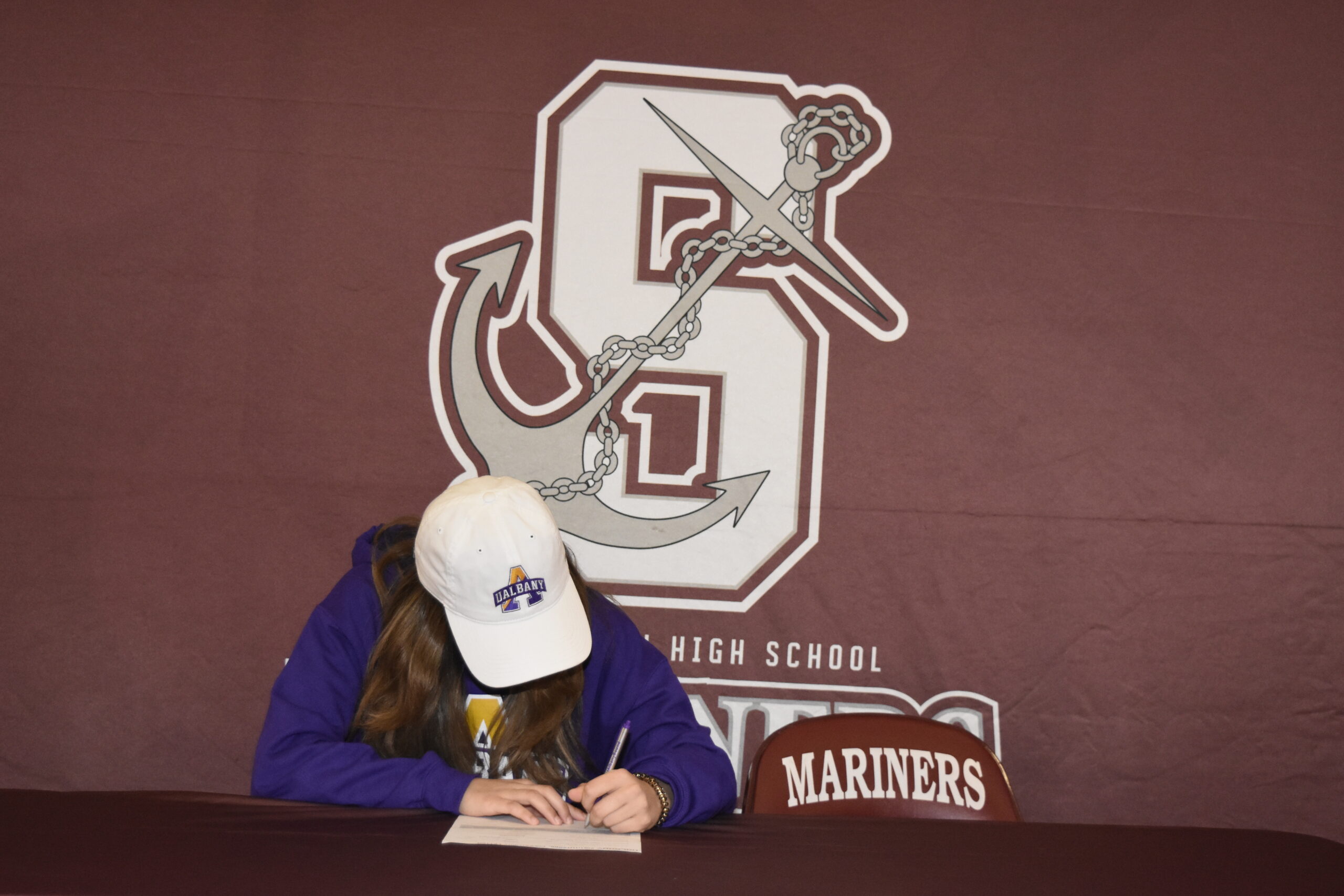 Gabriella Arnold signed her letter of intent to run track at the University of Albany on April 1.    DREW BUDD