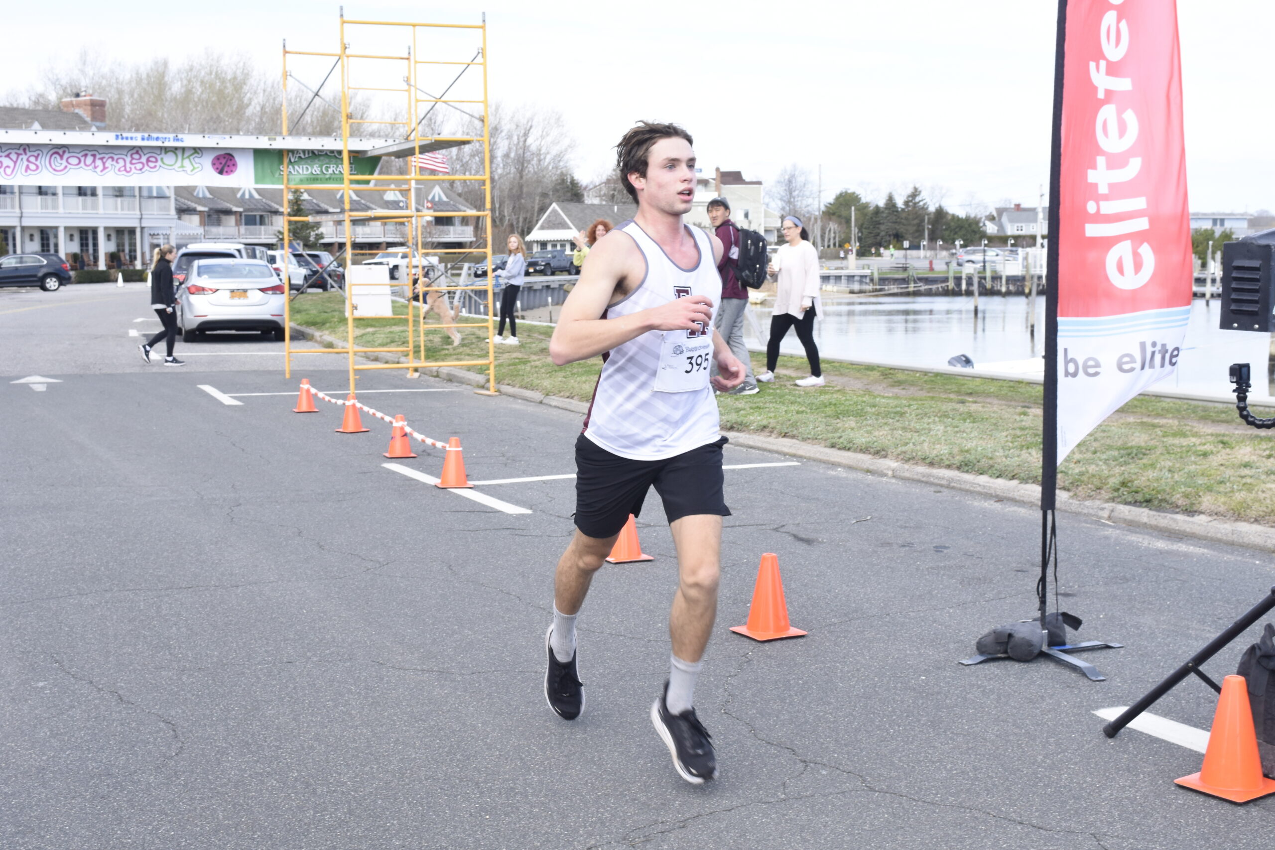 East Hampton's Evan Masi finished third overall.   DREW BUDD