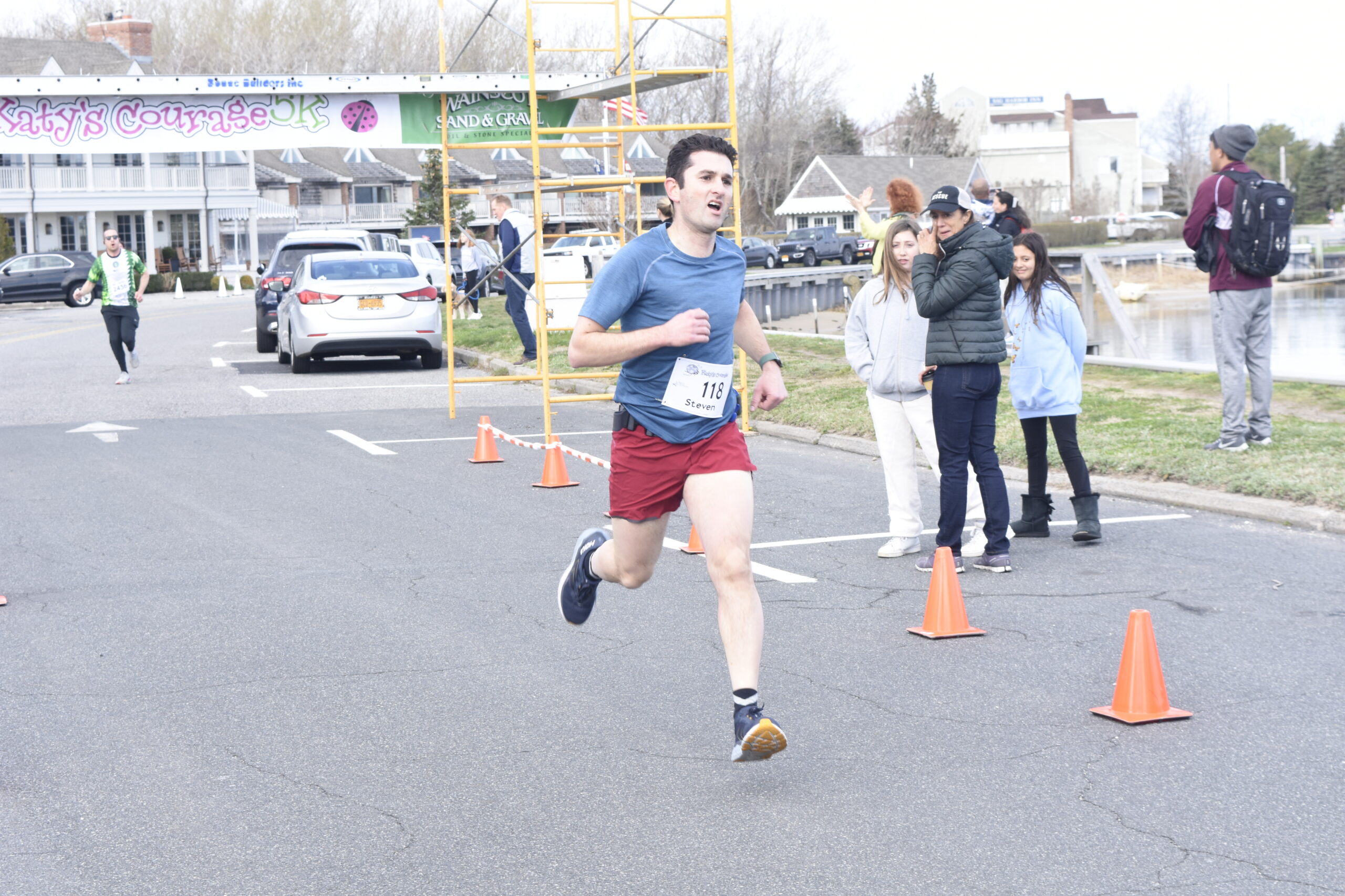 Steven Sobey of Sag Harbor was the first non-high school runner to finish Saturday's race, finishing 10th overall.    DREW BUDD