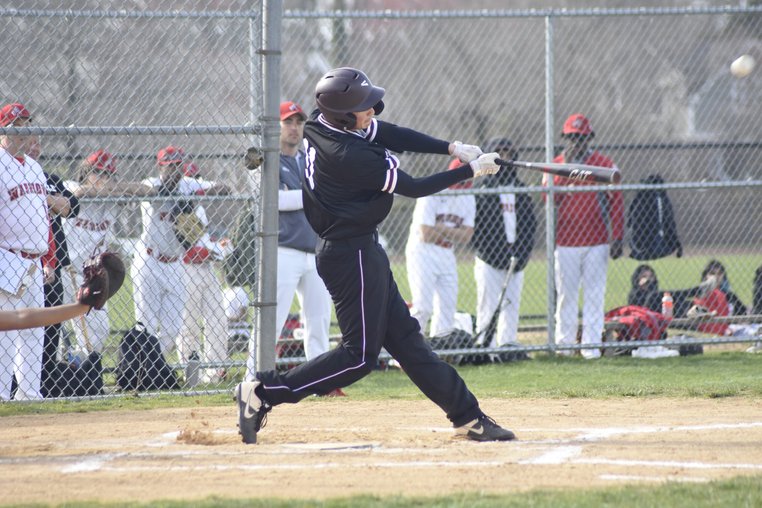 East Hampton senior Avery Siska launches a grand slam well over the left field fence giving his team an early 5-0 lead on Thursday, April 14.   DREW BUDD