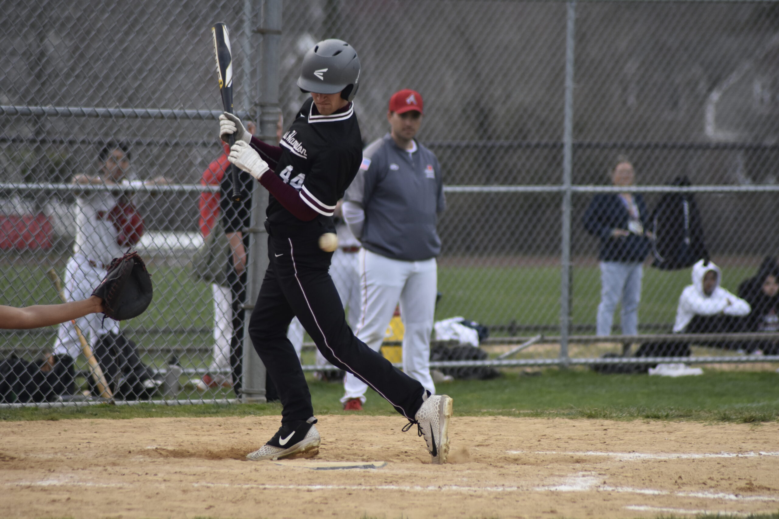 East Hampton's Michael Locascio is hit by a pitch.   DREW BUDD