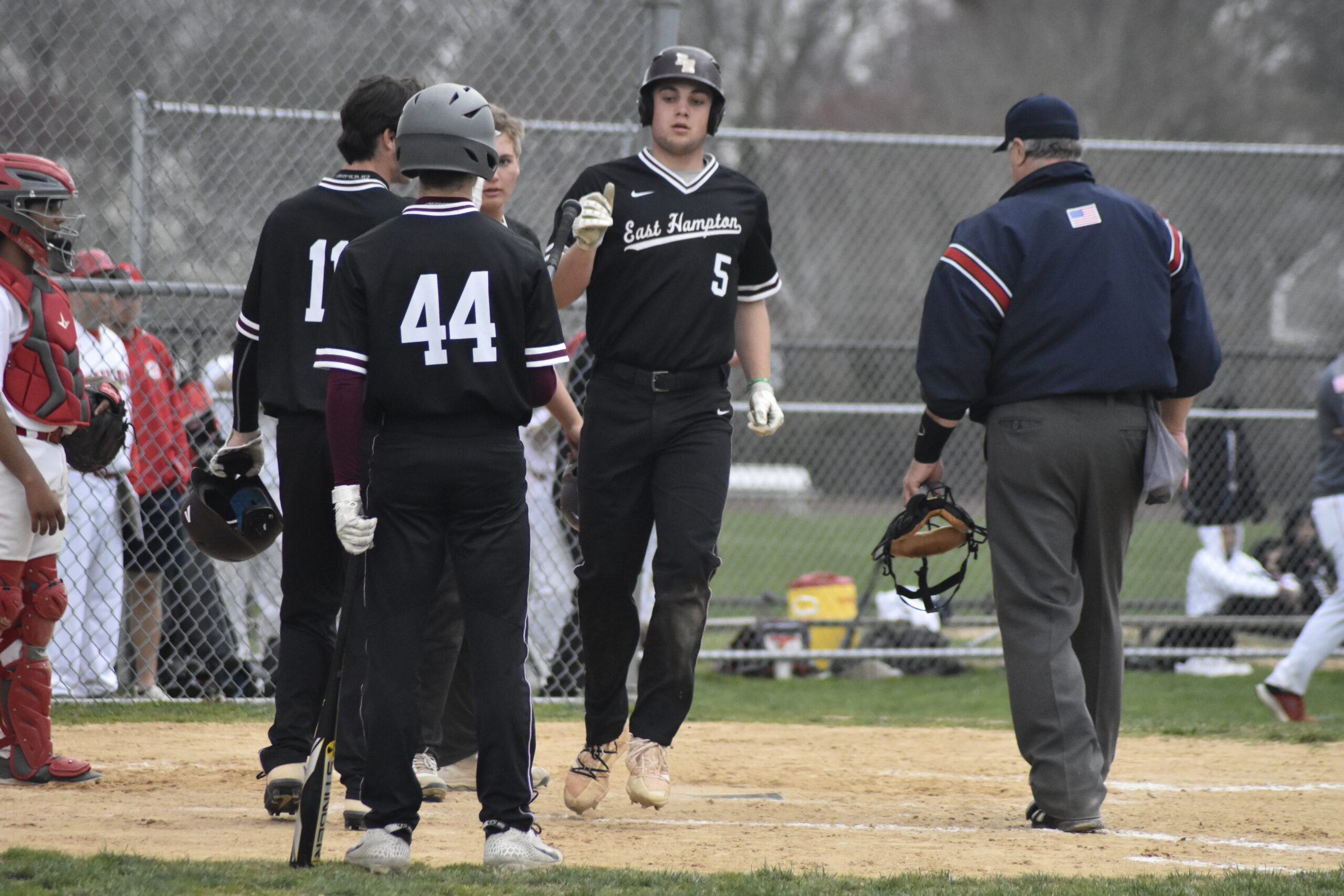 Bonacker Jack Dickinson is congratulated at home plate after his three-run home run in the top of the seventh inning.   DREW BUDD