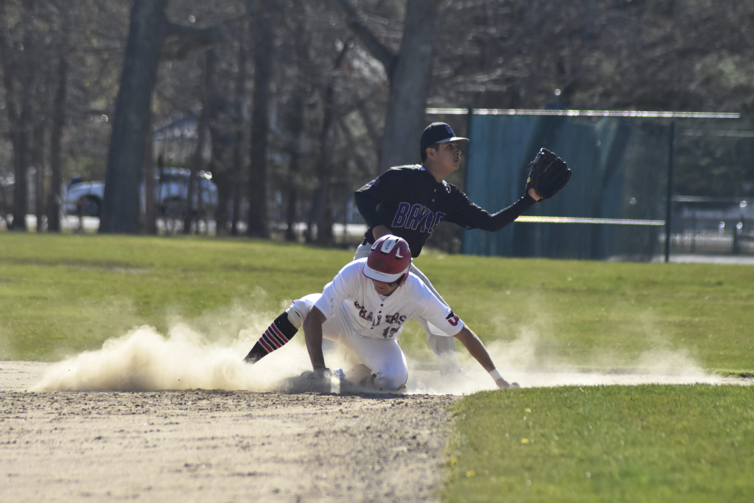 Reed Kelsey swipes second base for Pierson.   DREW BUDD