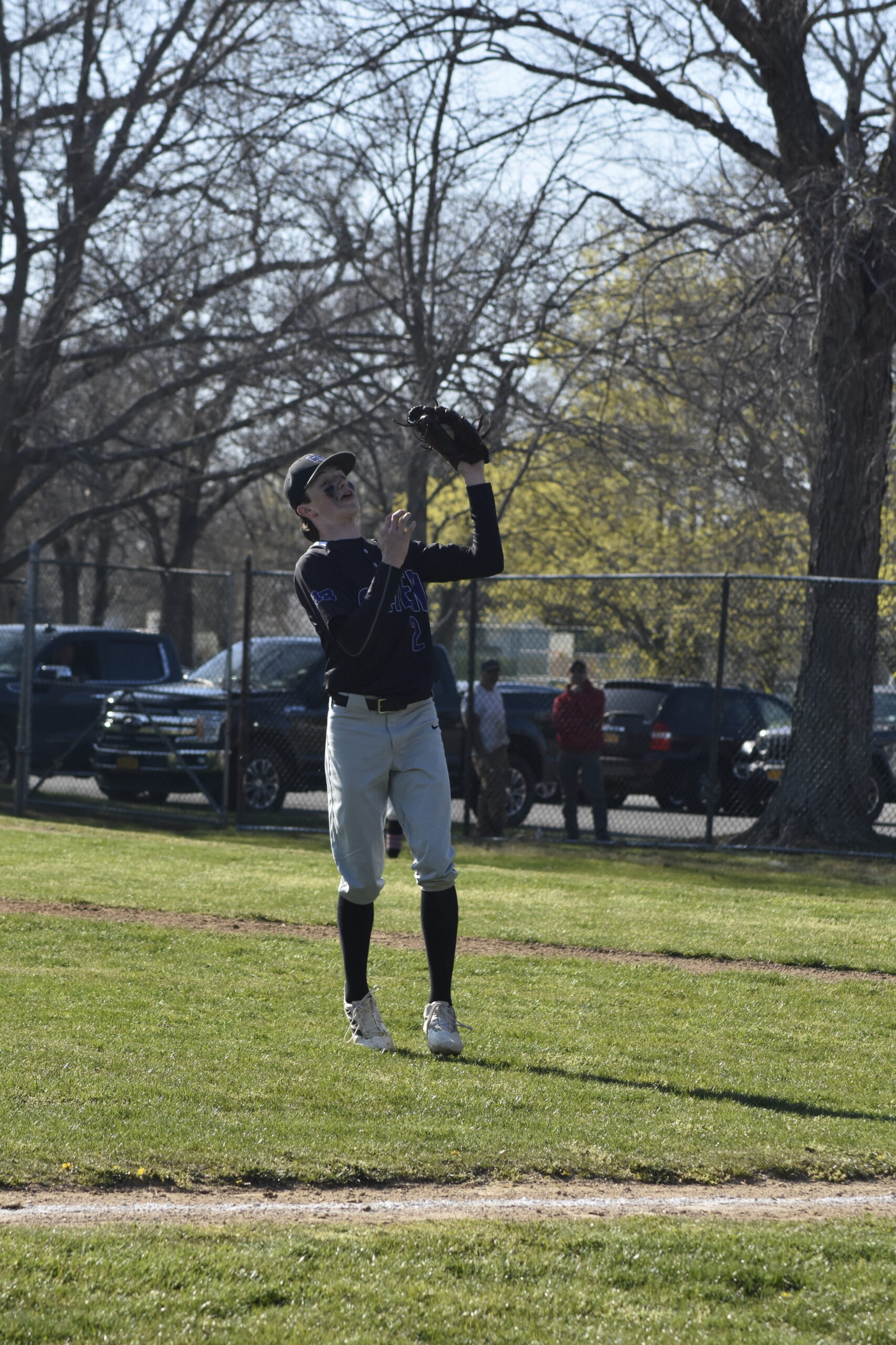 Patrick Donahue catches a pop fly then doubles off the runner at third base.   DREW BUDD