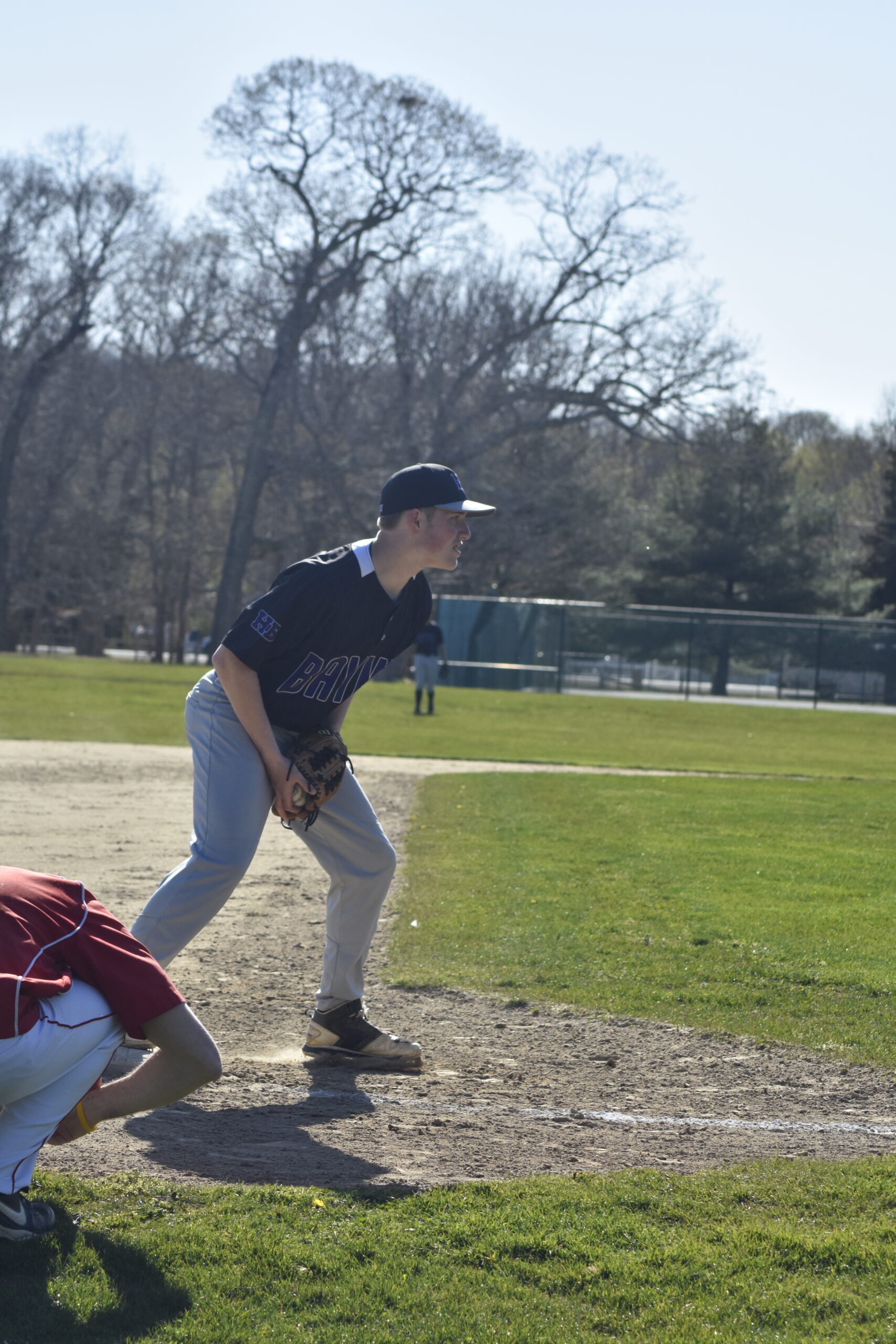 Hampton Bays third baseman Nate Donahue catches a throw from Patrick Donahue to double-up the Pierson runner off of third.   DREW BUDD