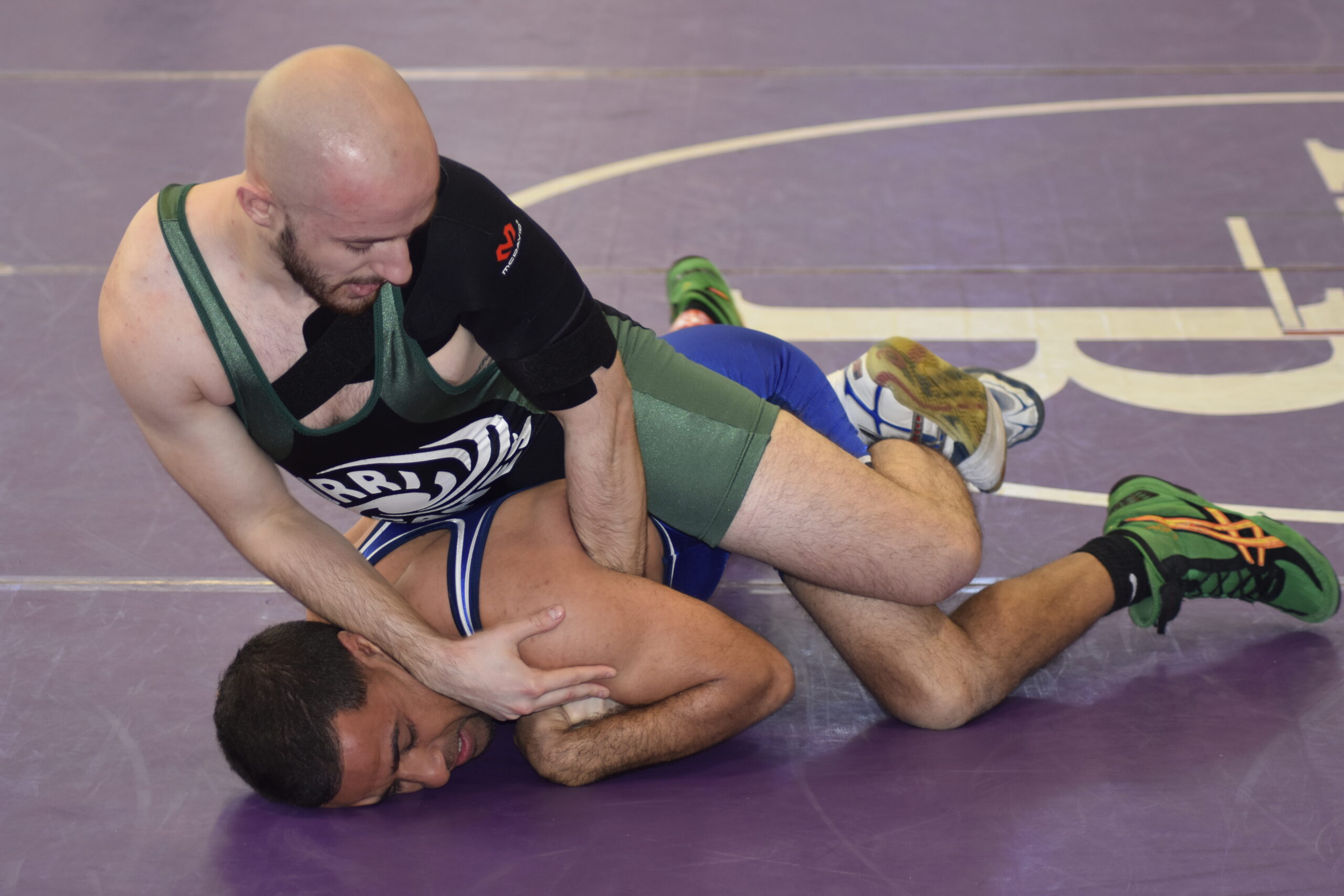 Westhampton Beach wrestling coach Andrew Petroulias also competed.   DREW BUDD