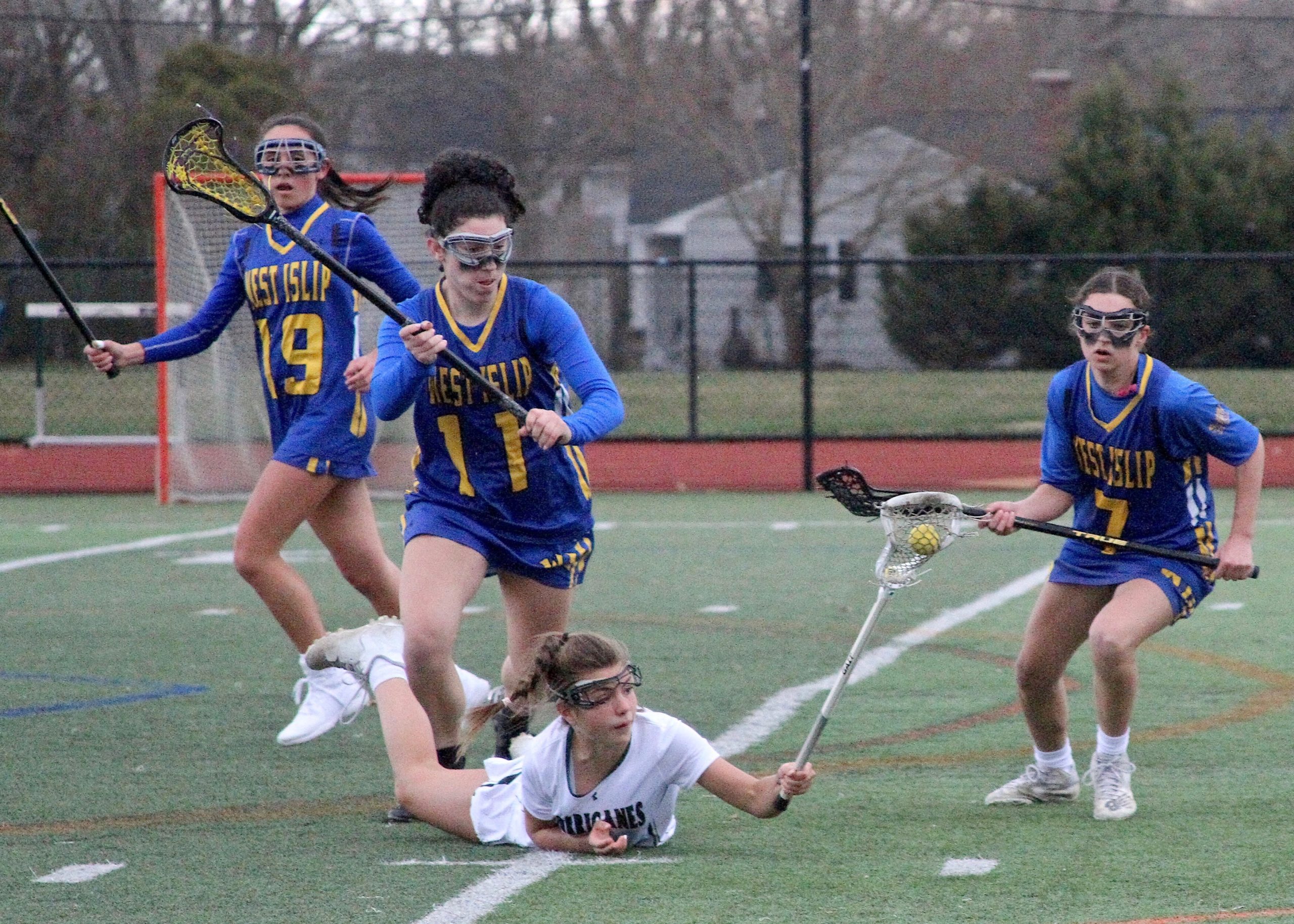 Westhampton Beach freshman Brie Provenzano maintains possession after tumbling to the turf. DESIRÉE KEEGAN