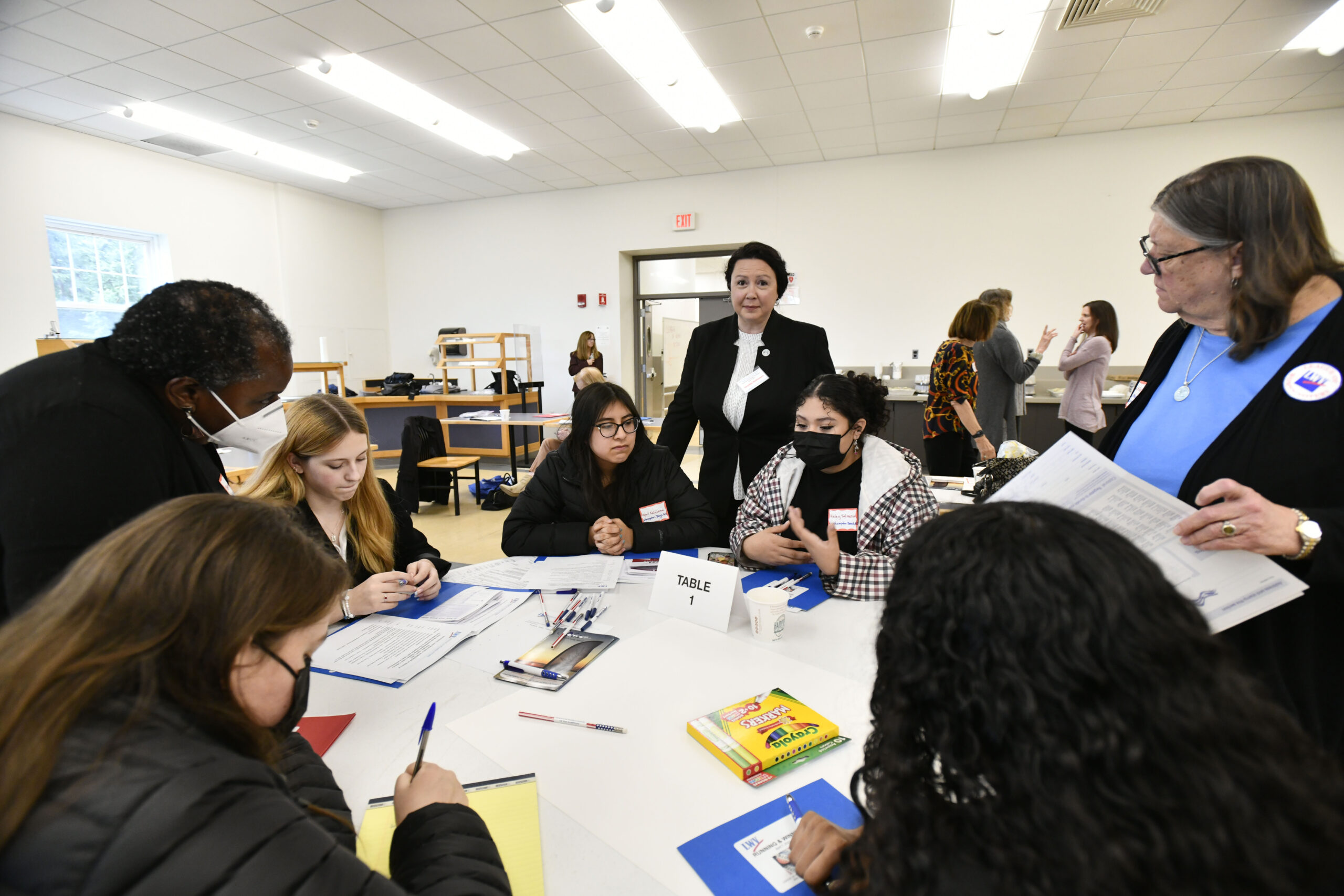 Southampton Town Councilwoman Cynthia McNamara works with students at 