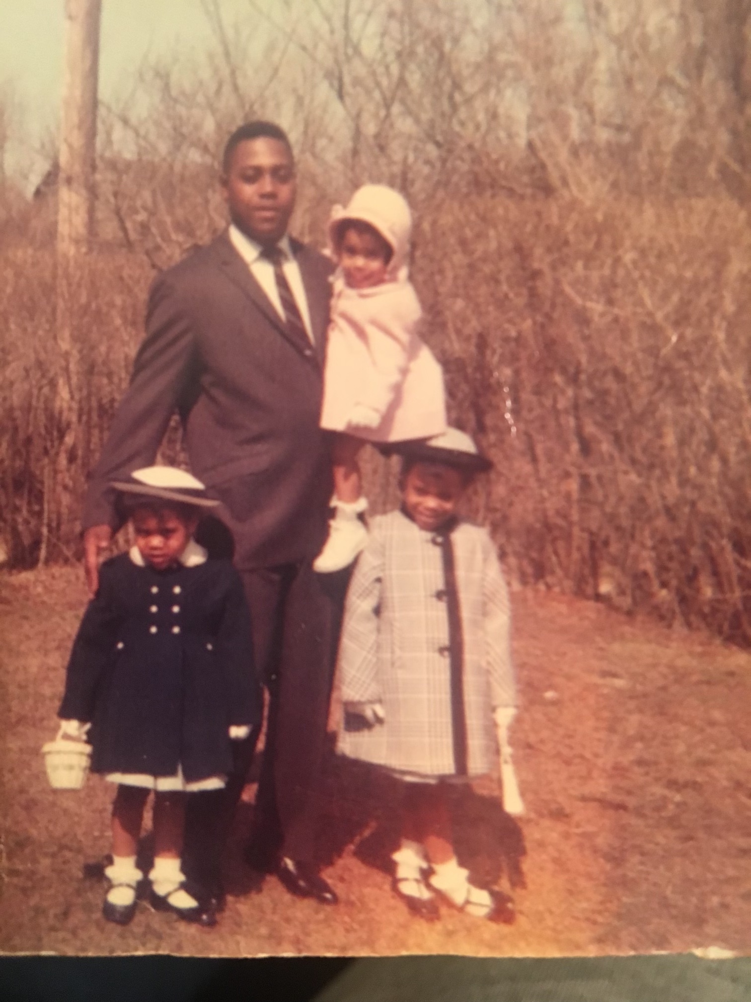 Elton Etheridge and his daughters, clockwise from top, Kim Etheridge-Jarvis, Wanda Turpin, and Linda Gilliam.